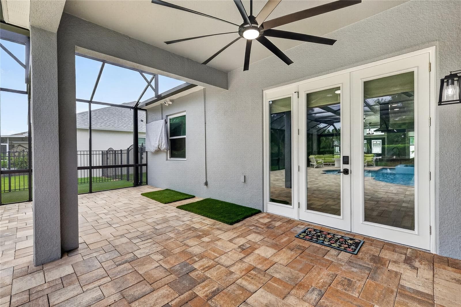 Covered lanai with a large fan ~ - 5006 RISHLEY RUN WAY, MOUNT DORA