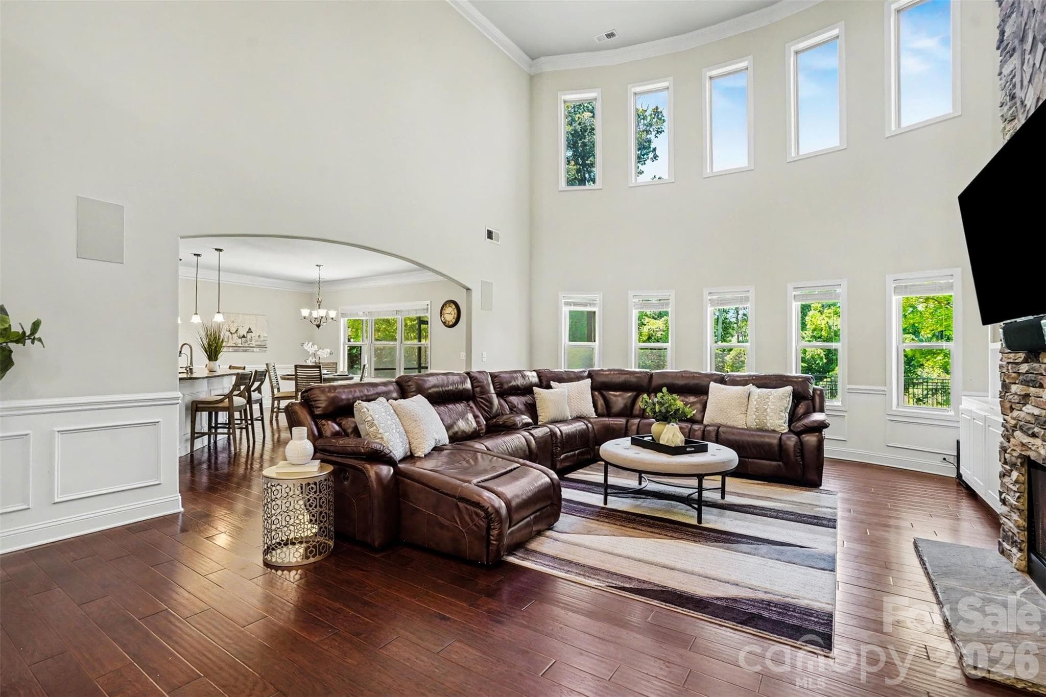 Wall of windows with beautiful views of the lush backyard! - Huntersville