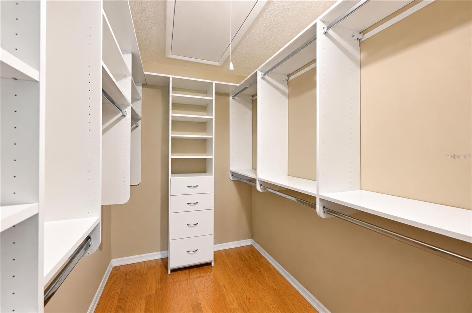 Primary bedroom walk-in closet - 9425 ANDOVER CIR, BRADENTON
