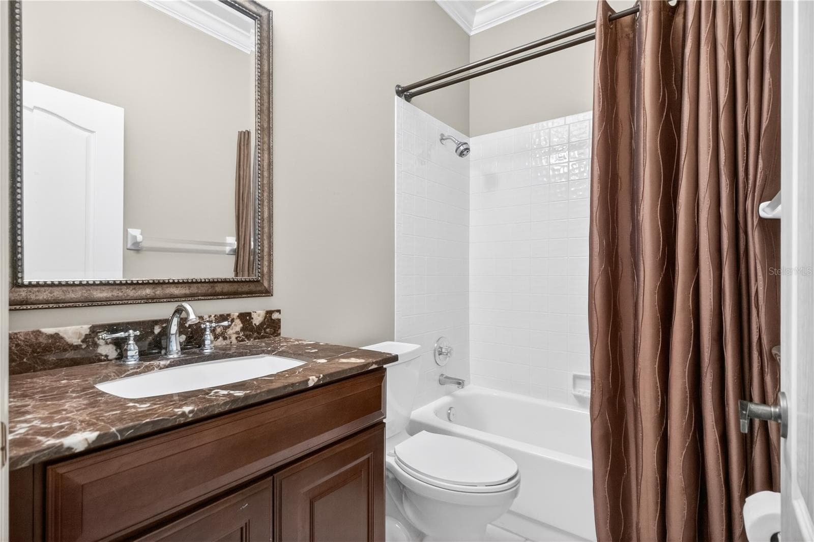 Bath two just outside the second bedroom with tub/shower combo - 6948 STONEYWALK CT, BRADENTON