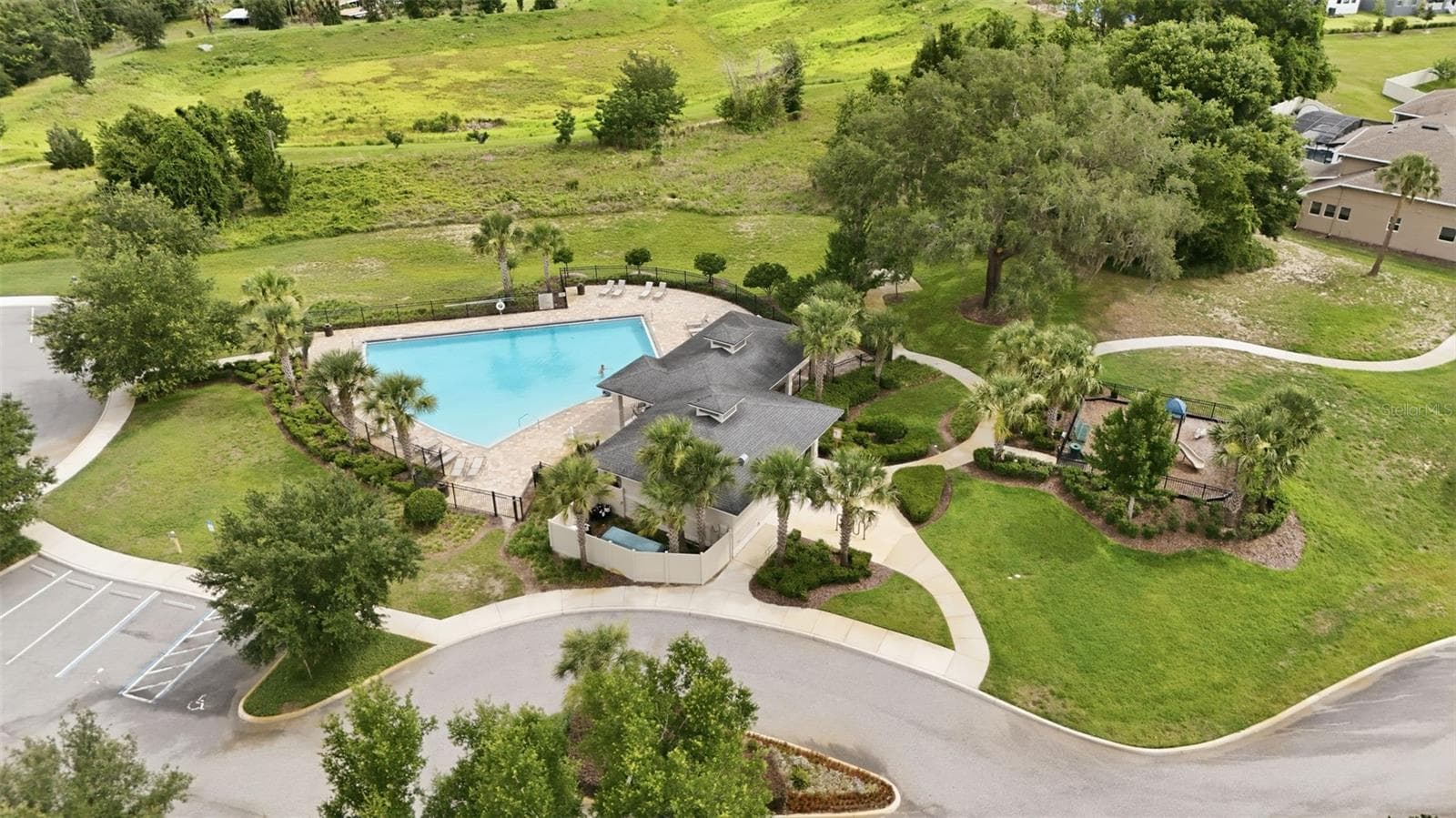 Community pool and playground at John's Lake Landing - 16716 ABBEY HILL CT, CLERMONT