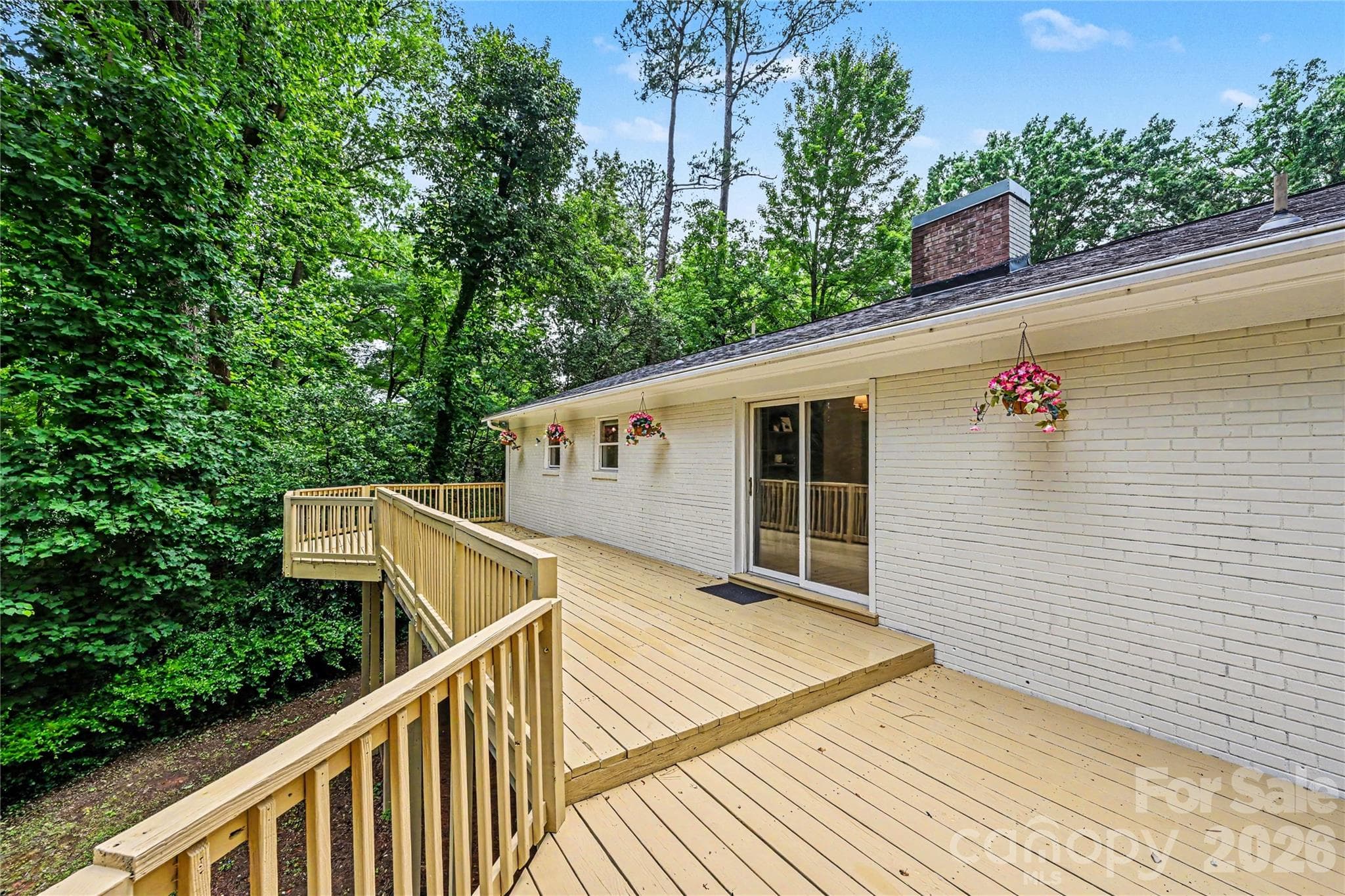 Multiple seating and entertaining areas make this impressive outdoor living space an extension of the home. - Concord