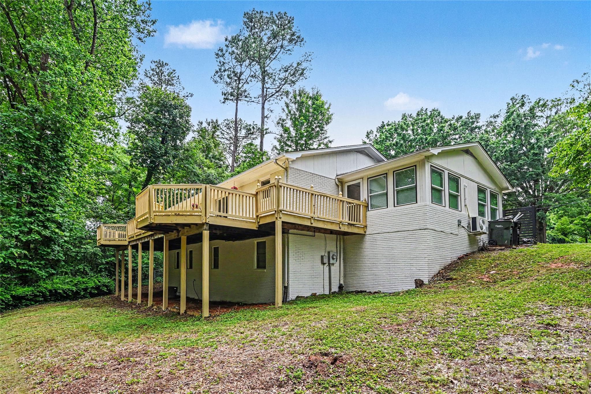 Private backyard setting with mature trees, a storage building, and over 600 square feet of deck space to enjoy it all. - Concord