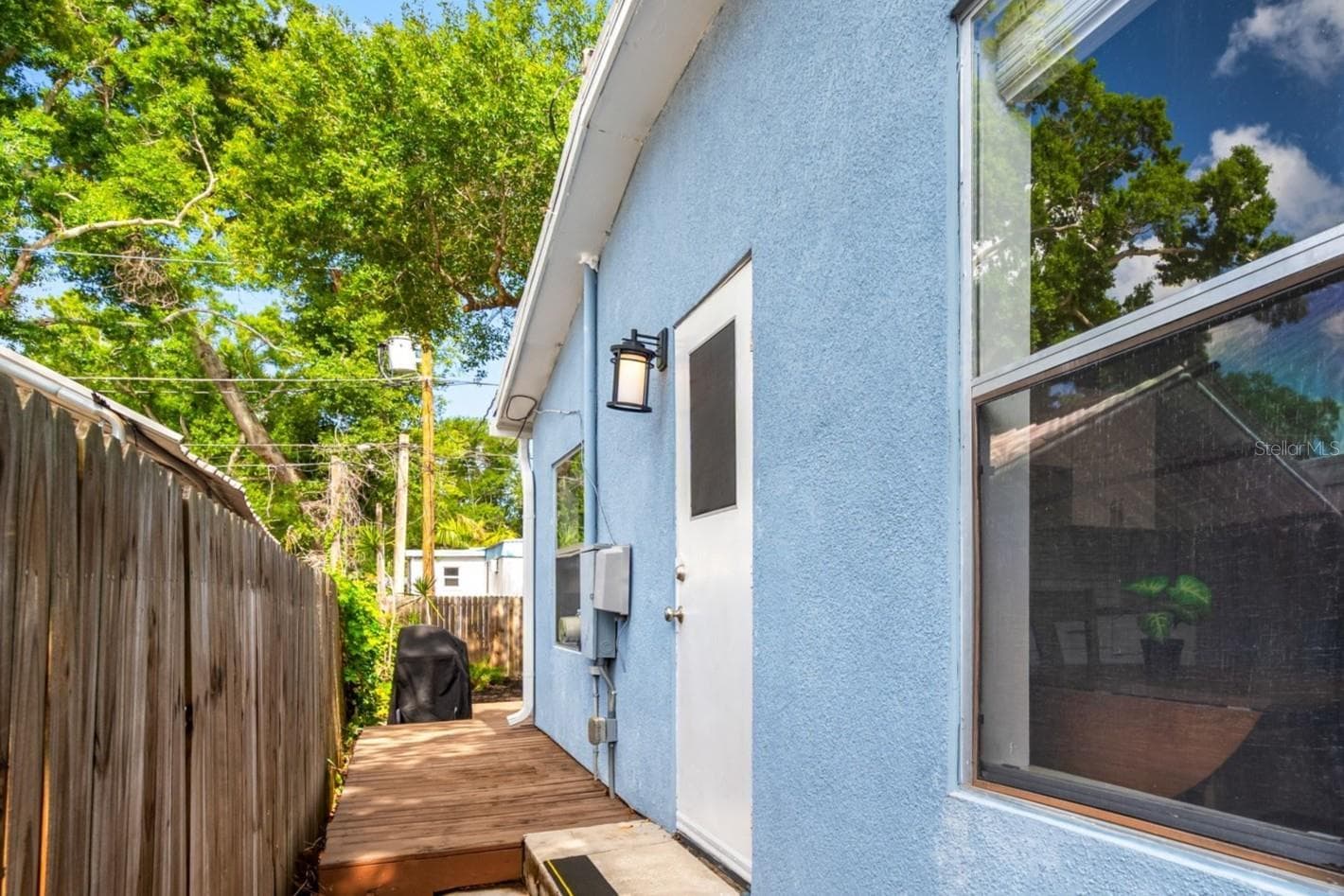 Side door from kitchen to deck and back yard. - 5044 BETTY ST N, ST PETERSBURG