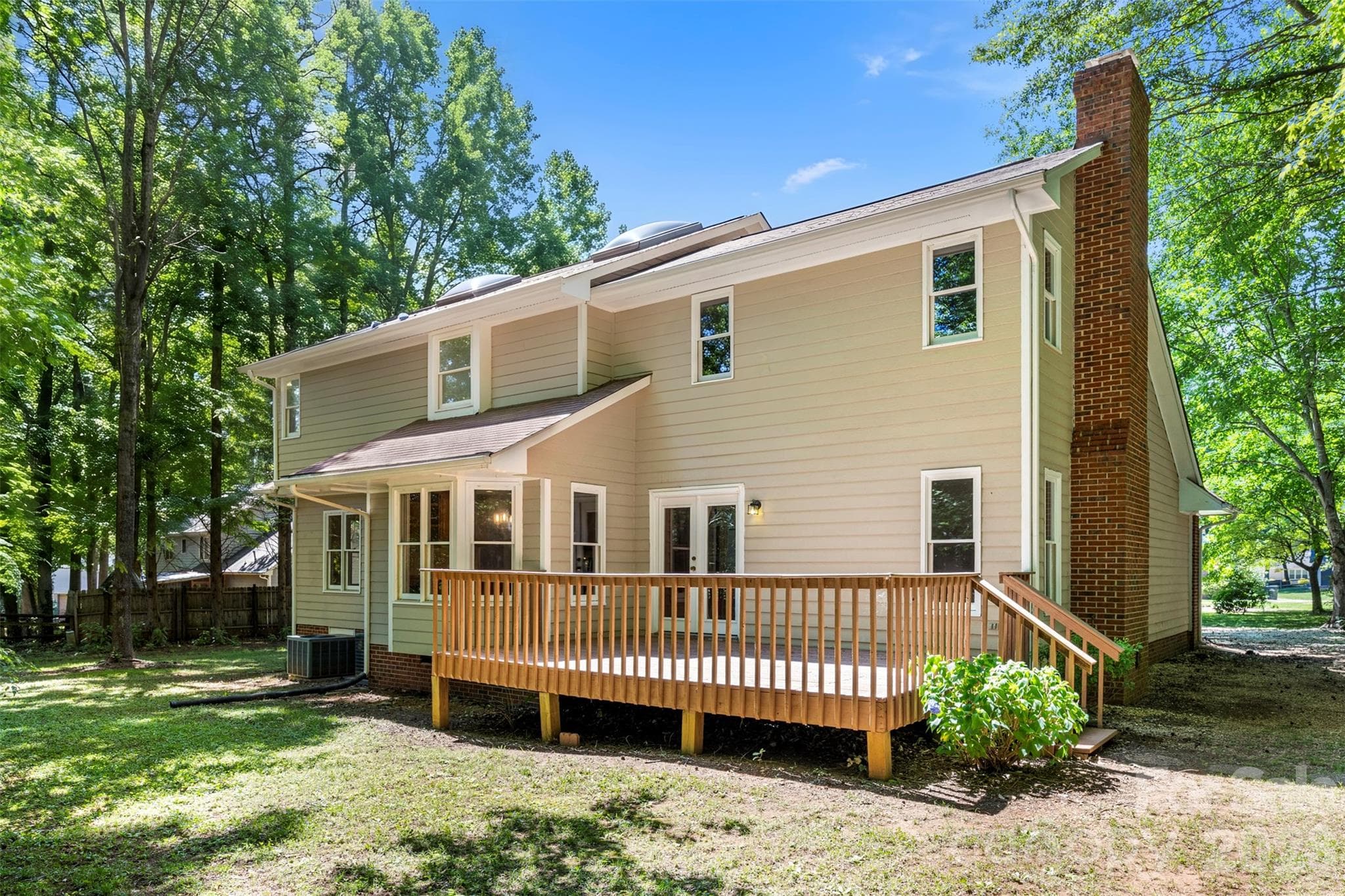 Expansive back yard and deck allows for outdoor bbq's etc for family and friends. - Gastonia