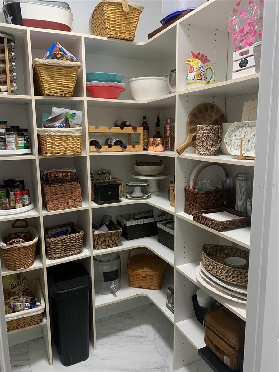 walk-in pantry with solid shelving - 5318 LOON NEST CT, APOLLO BEACH
