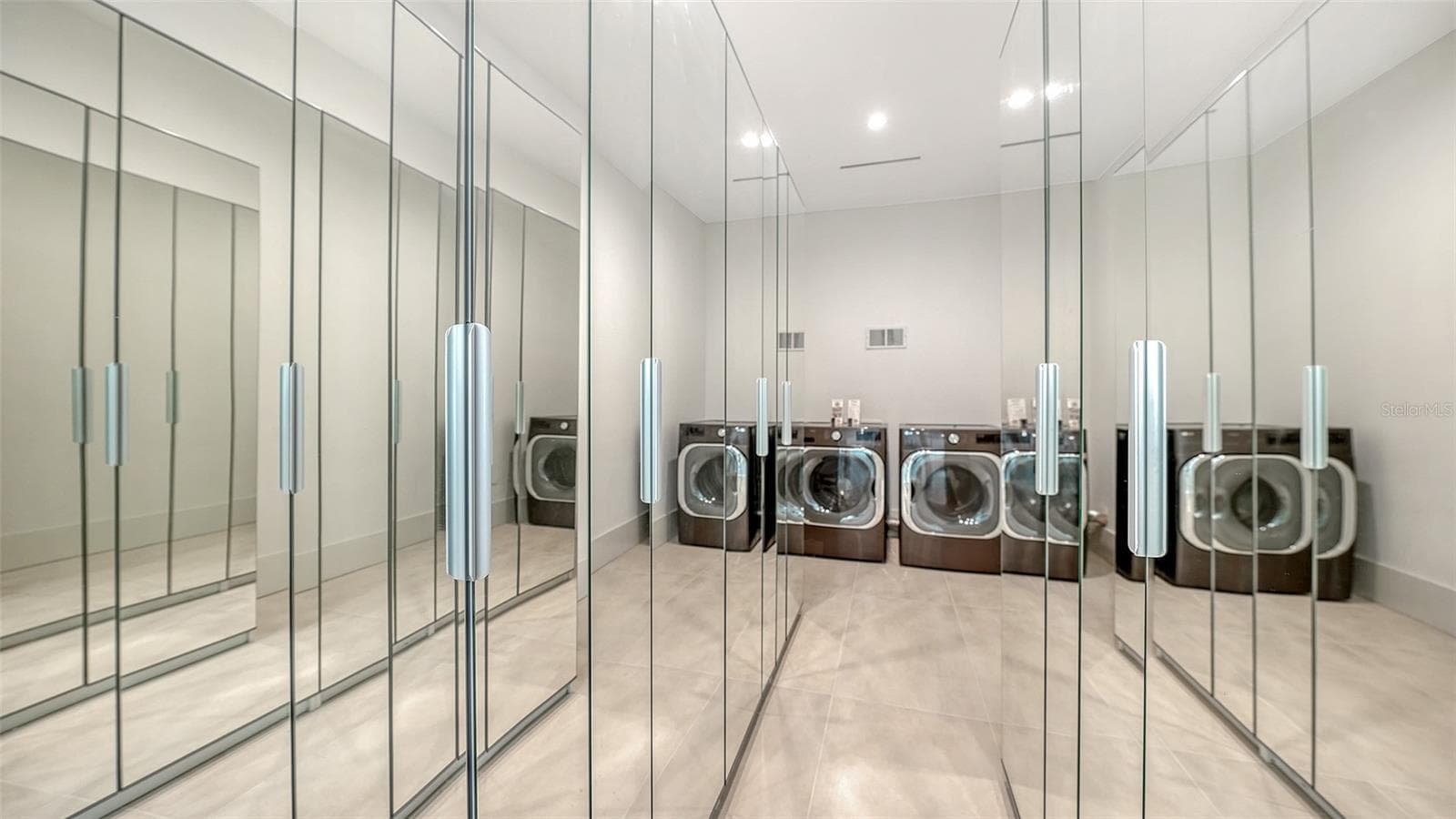 Primary walk-in closet with 2nd washer and dryer - 2138 HAWTHORNE ST, SARASOTA