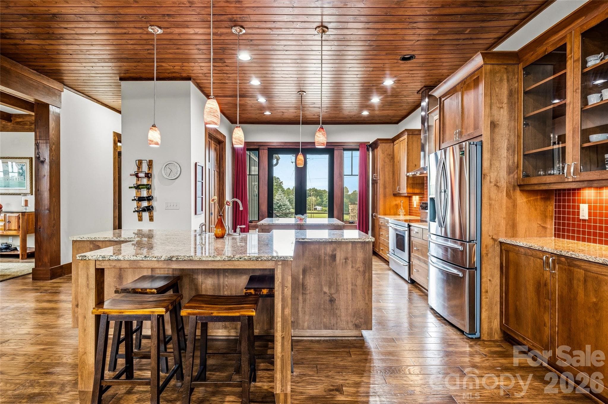 Expansive granite kitchen with tile backsplash - 4862 Pinnacle Mountain Road, Zirconia