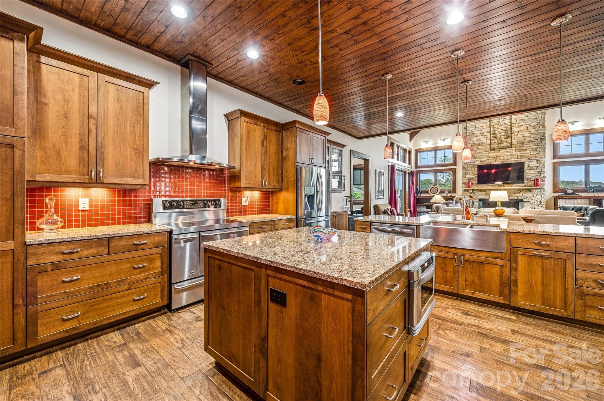 Convenient kitchen island and custom cherry soft-close cabinetry - 4862 Pinnacle Mountain Road, Zirconia