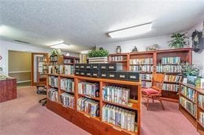 LIBRARY IN THE MAIN CLUBHOUSE. - 5920 80TH ST N #308, ST PETERSBURG
