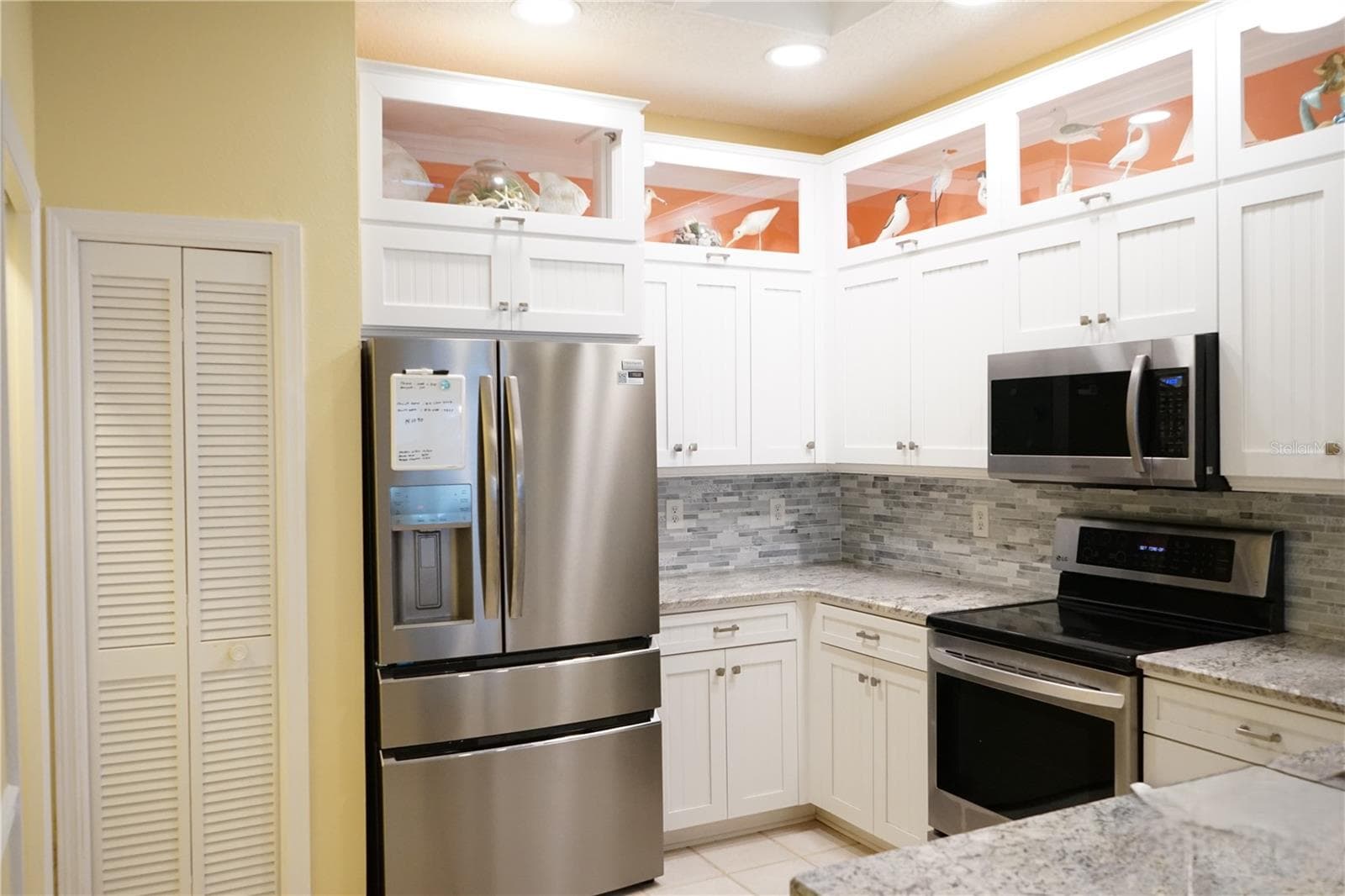 closet pantry, stainless appliances, lighted cabinets - 652 MC DANIEL ST, SUN CITY CENTER