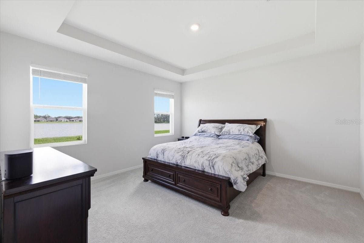 Primary bedroom with gorgeous water views - 1413 TROPICAL OASIS AVE, PLANT CITY