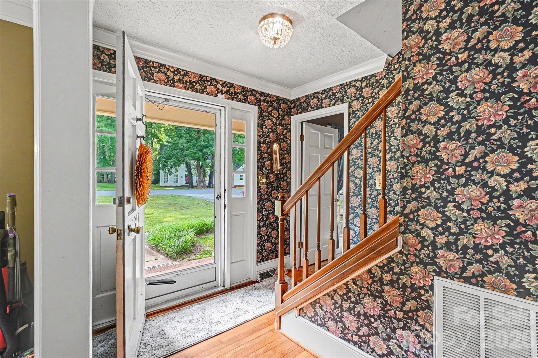 Open the door to the foyer with immediate access to the dining room on one side and living room on the other. - Shelby
