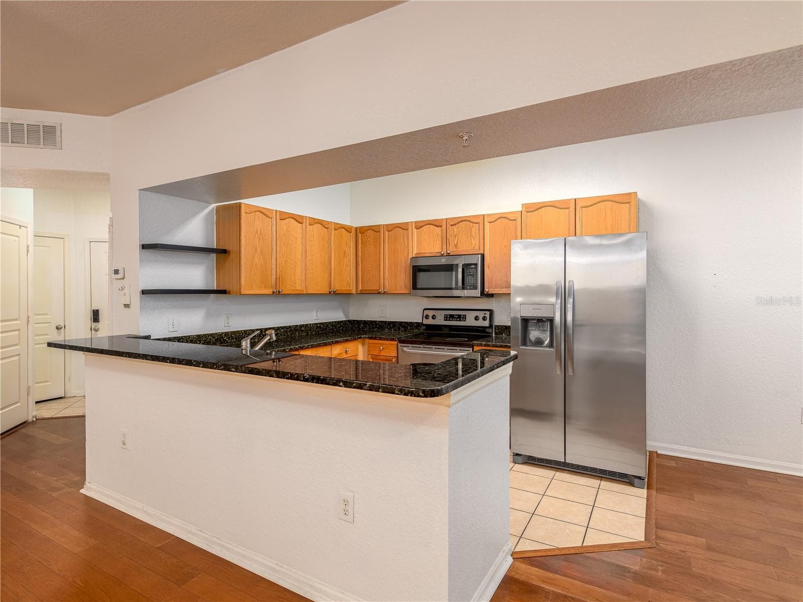 view of kitchen from living area - 5125 PALM SPRINGS BLVD #7108, TAMPA
