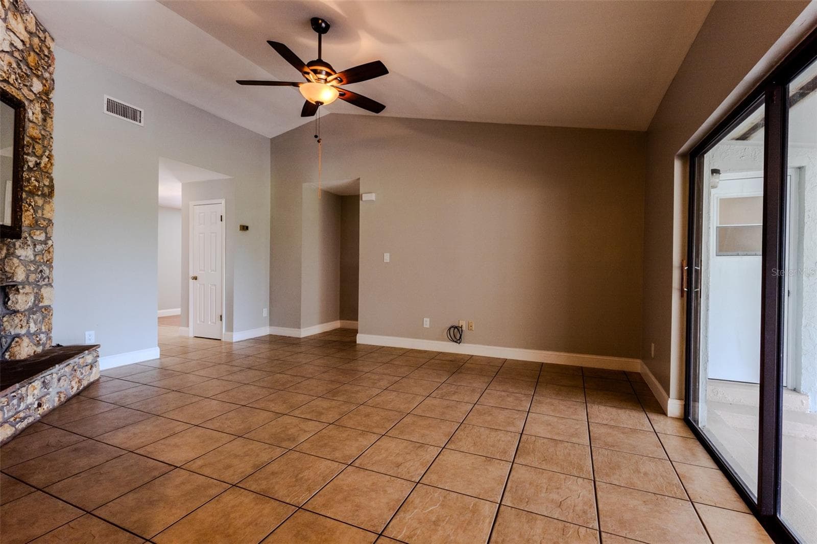 Family room and hallway to split-side bedrooms and guest bath - 1861 CROWLEY CIR E, LONGWOOD