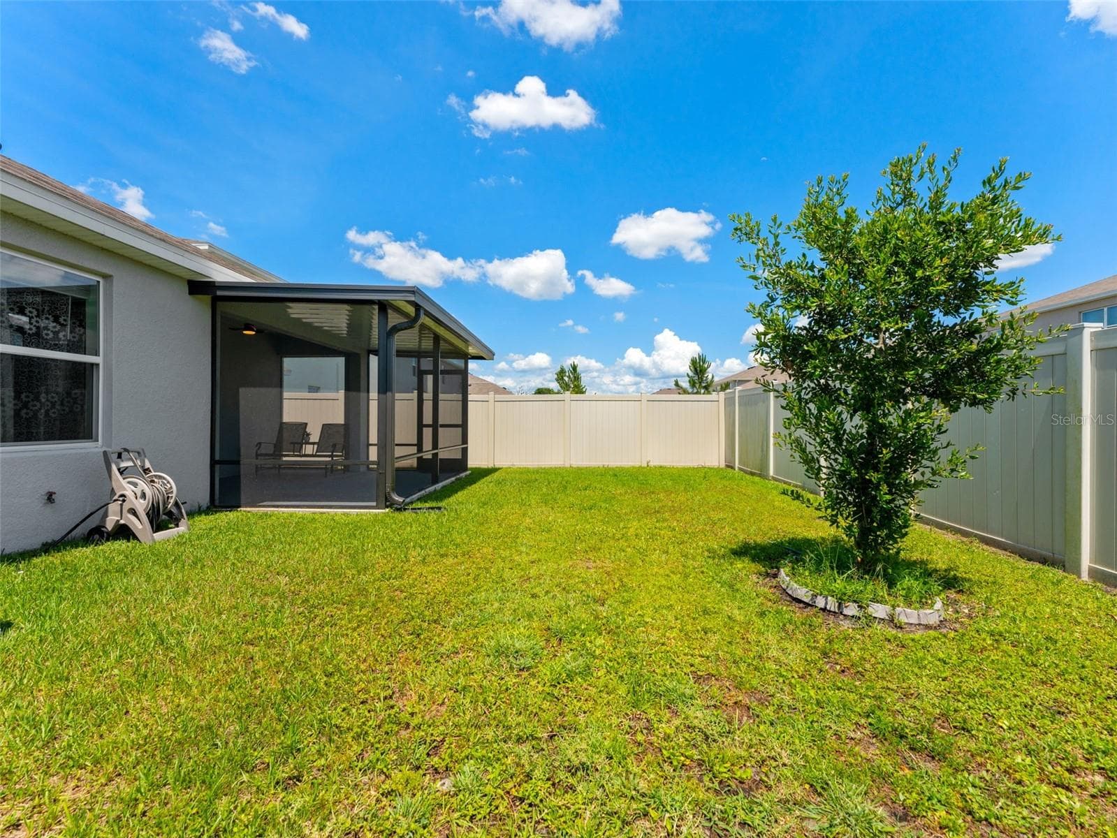 Extended patio, covered and screened in your fully fenced back yard. - 5782 HOLLINGWORTH TRL, WESLEY CHAPEL