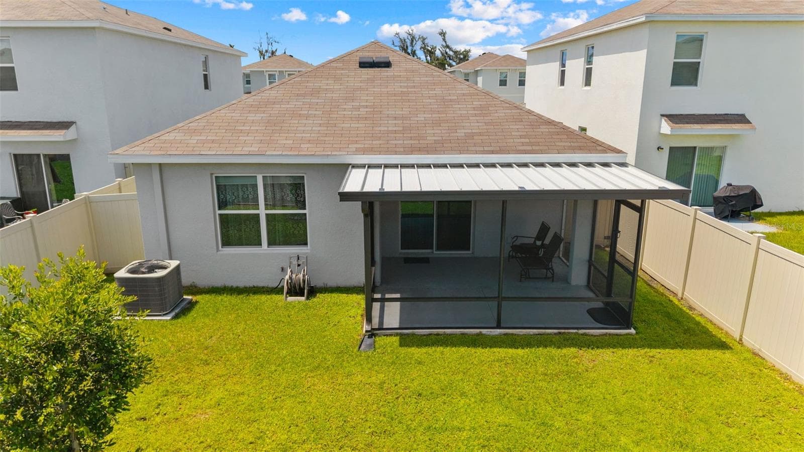 Extended patio, covered and screened in your fully fenced back yard. - 5782 HOLLINGWORTH TRL, WESLEY CHAPEL