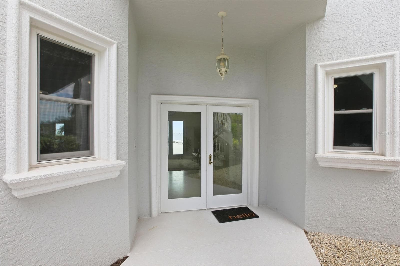 Ground floor entry under winding staircase - 7524 WESTMORELAND DR, SARASOTA