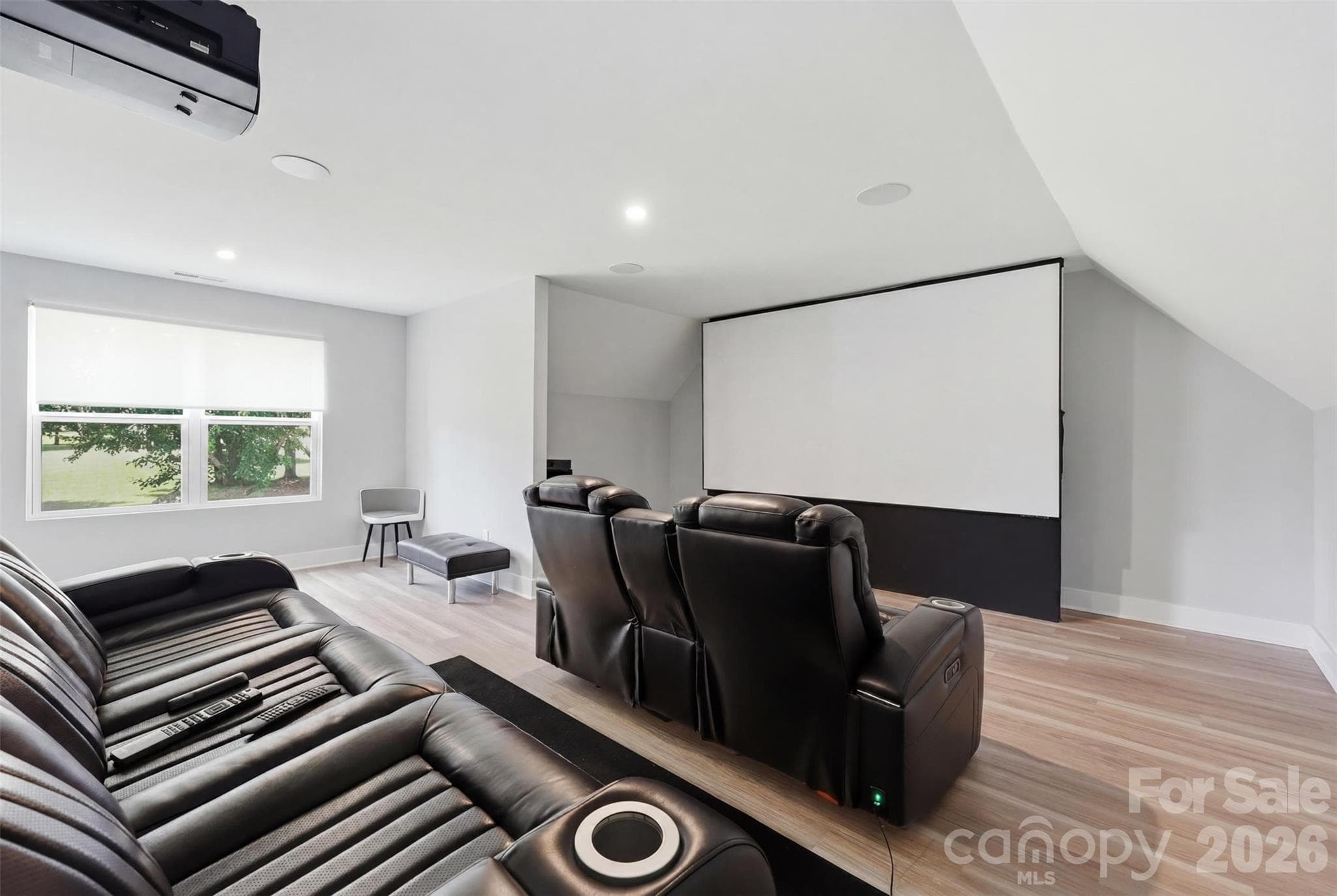 BEN Q projector, Dolby Atmos system, and sound transparent screen, and cinema seating makes movie watching a remarkable experience - Rock Hill