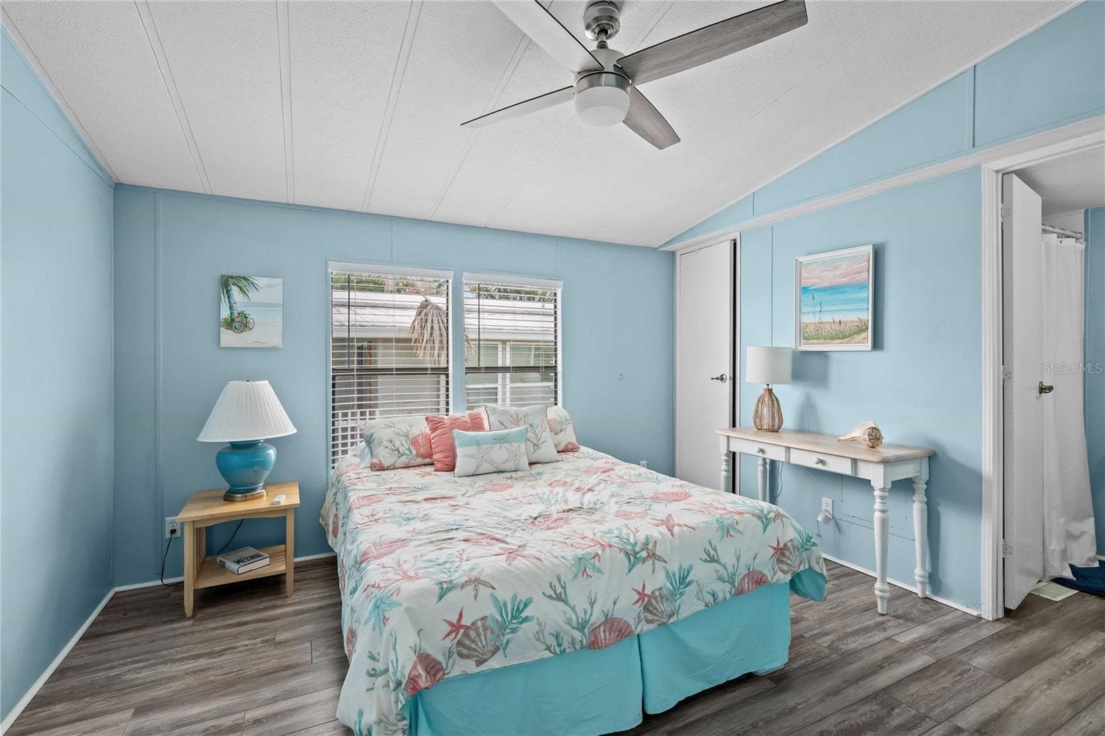 Primary bedroom has ceiling fan, walk-in closet, updated flooring, so much more! - 36428 MALIBU WAY, ZEPHYRHILLS