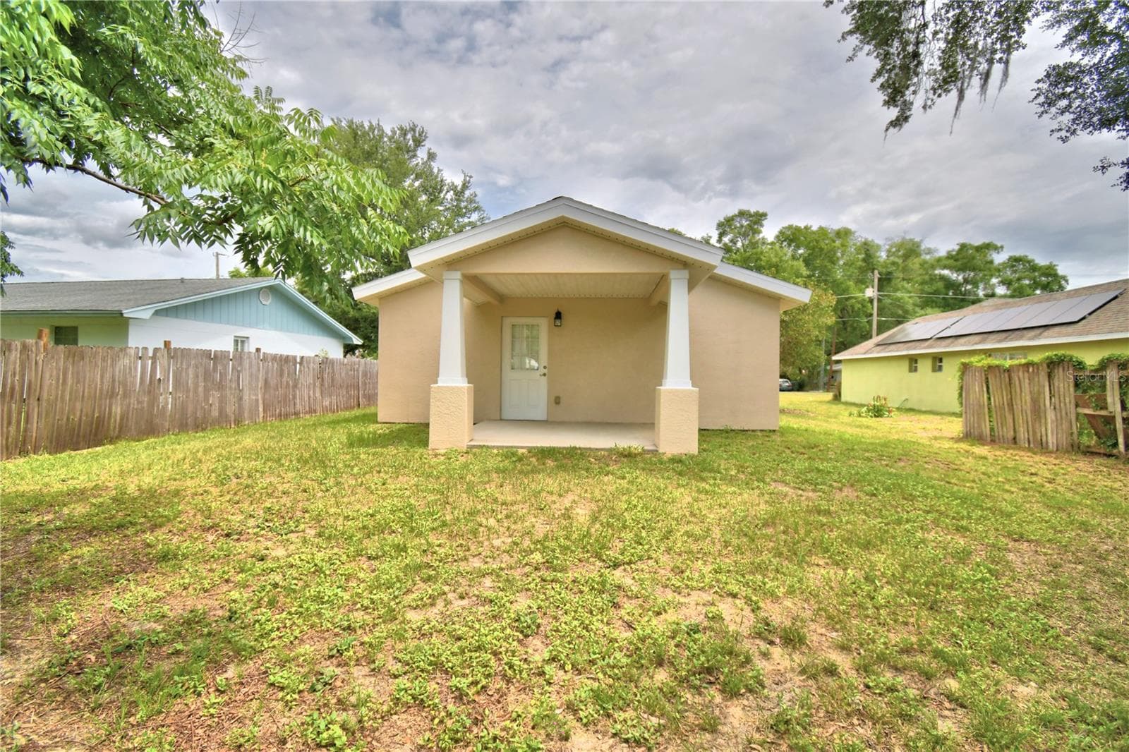 Middle of backyard looking to the house. - 2456 BATES AVE SW, WINTER HAVEN