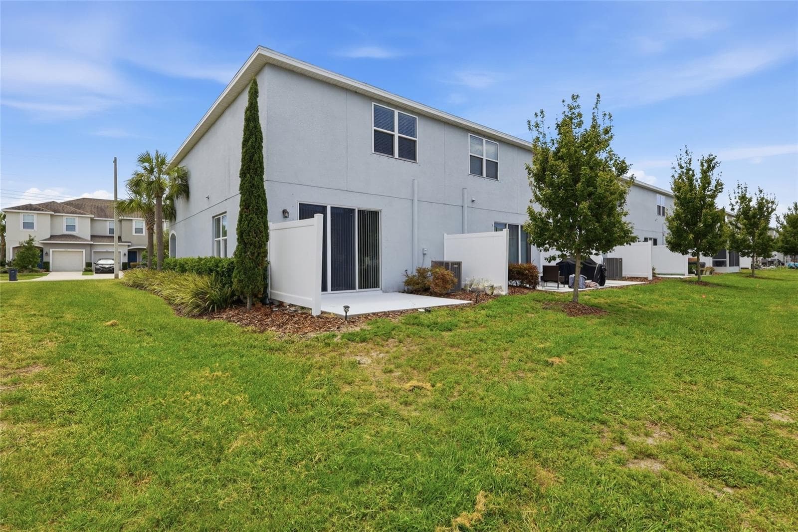 Rear exterior view showcasing the home's private outdoor space - 7005 GRAND ELM DR, RIVERVIEW