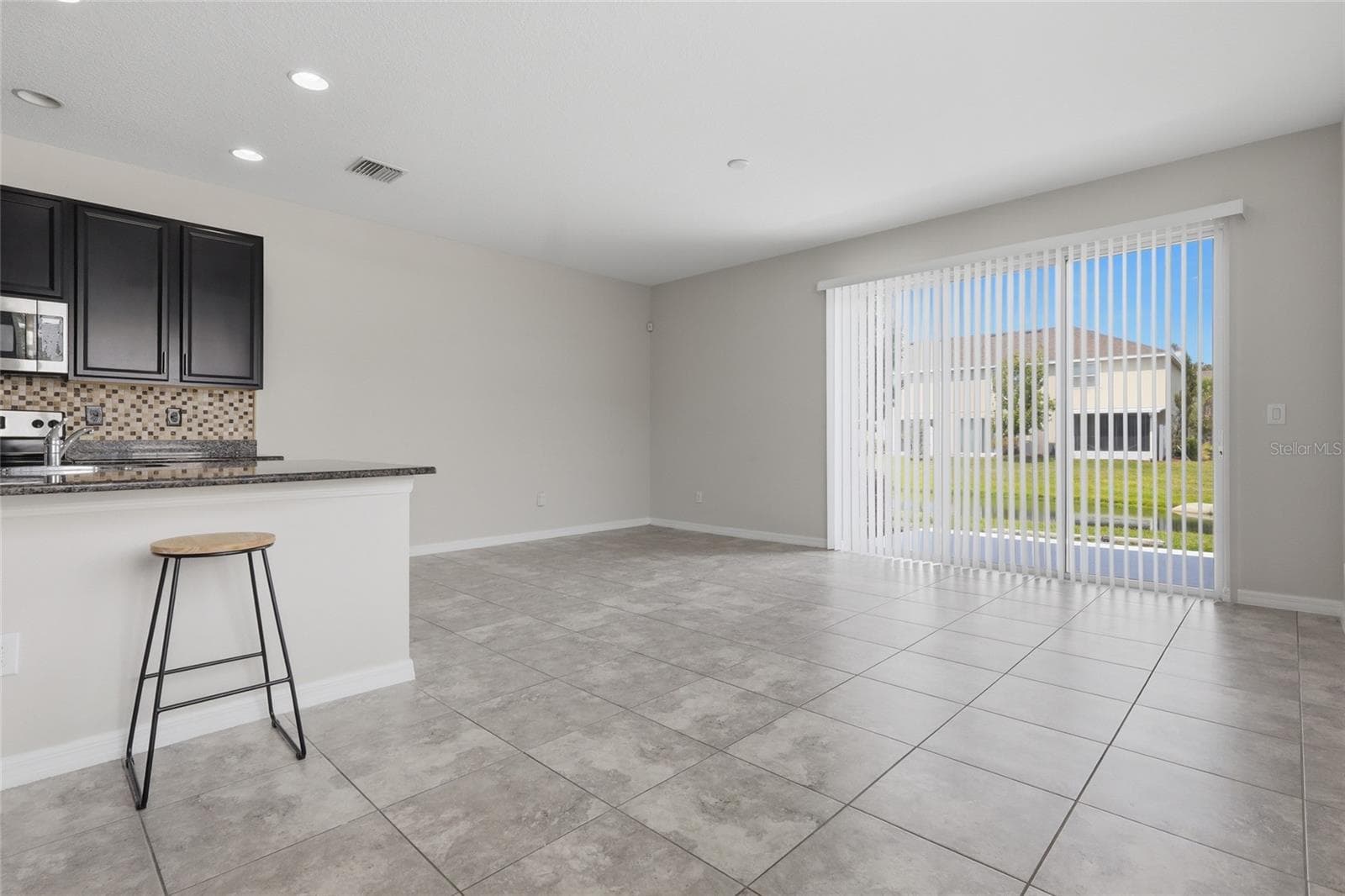Open concept living area featuring an eat in kitchen and abundant natural light - 7005 GRAND ELM DR, RIVERVIEW