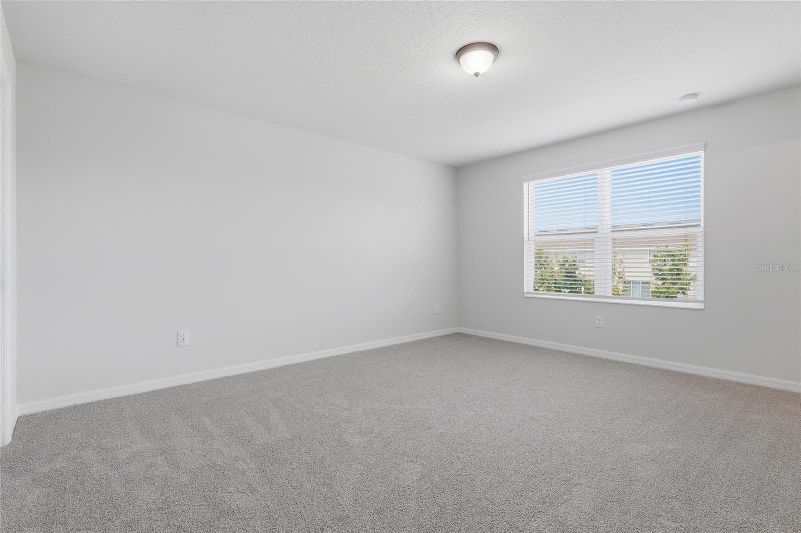 Additional bedroom view highlighting the room's spacious layout - 7005 GRAND ELM DR, RIVERVIEW