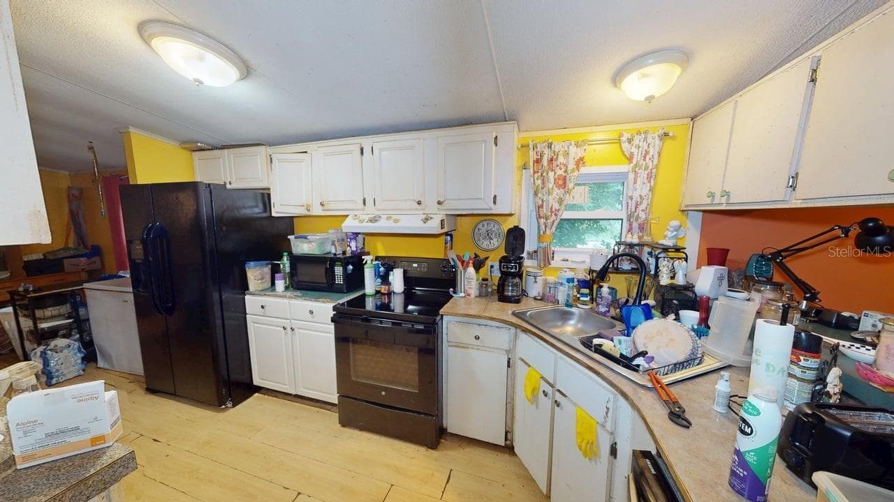 kitchen view from living room side - 30501 CLEARVIEW DR, WESLEY CHAPEL