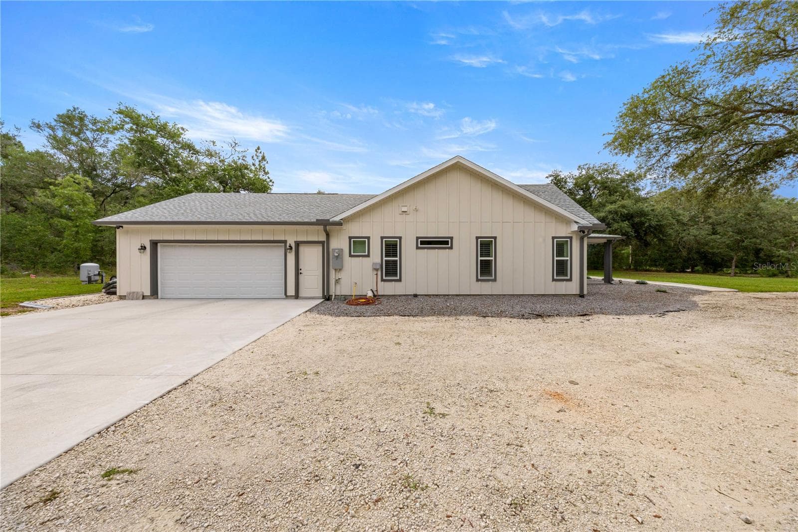 Side of Home with Garage Door - 18272 SW 65TH LOOP, DUNNELLON