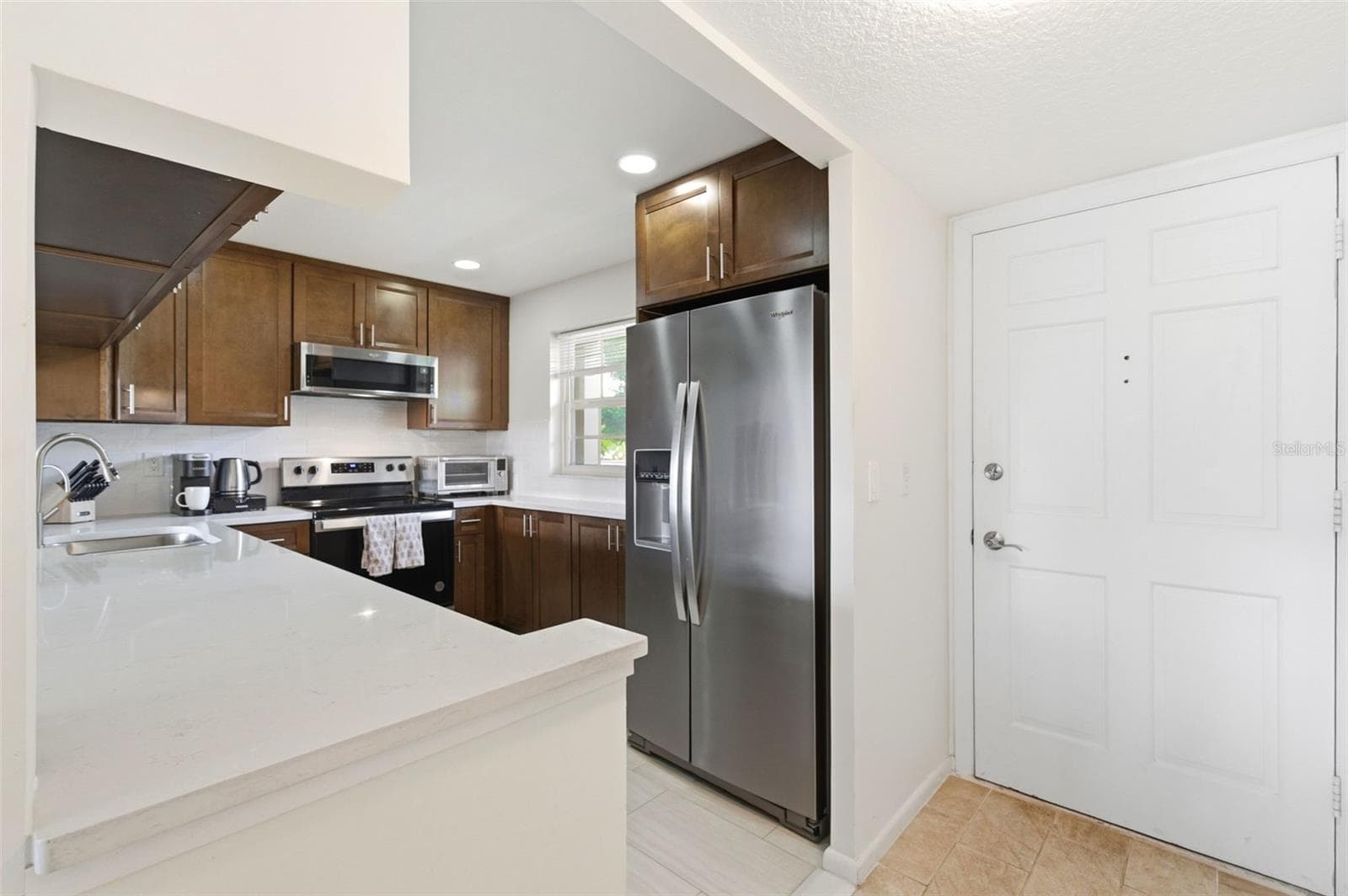 Kitchen is to your right upon entering the home. - 19029 US HIGHWAY 19 N #7-12, CLEARWATER