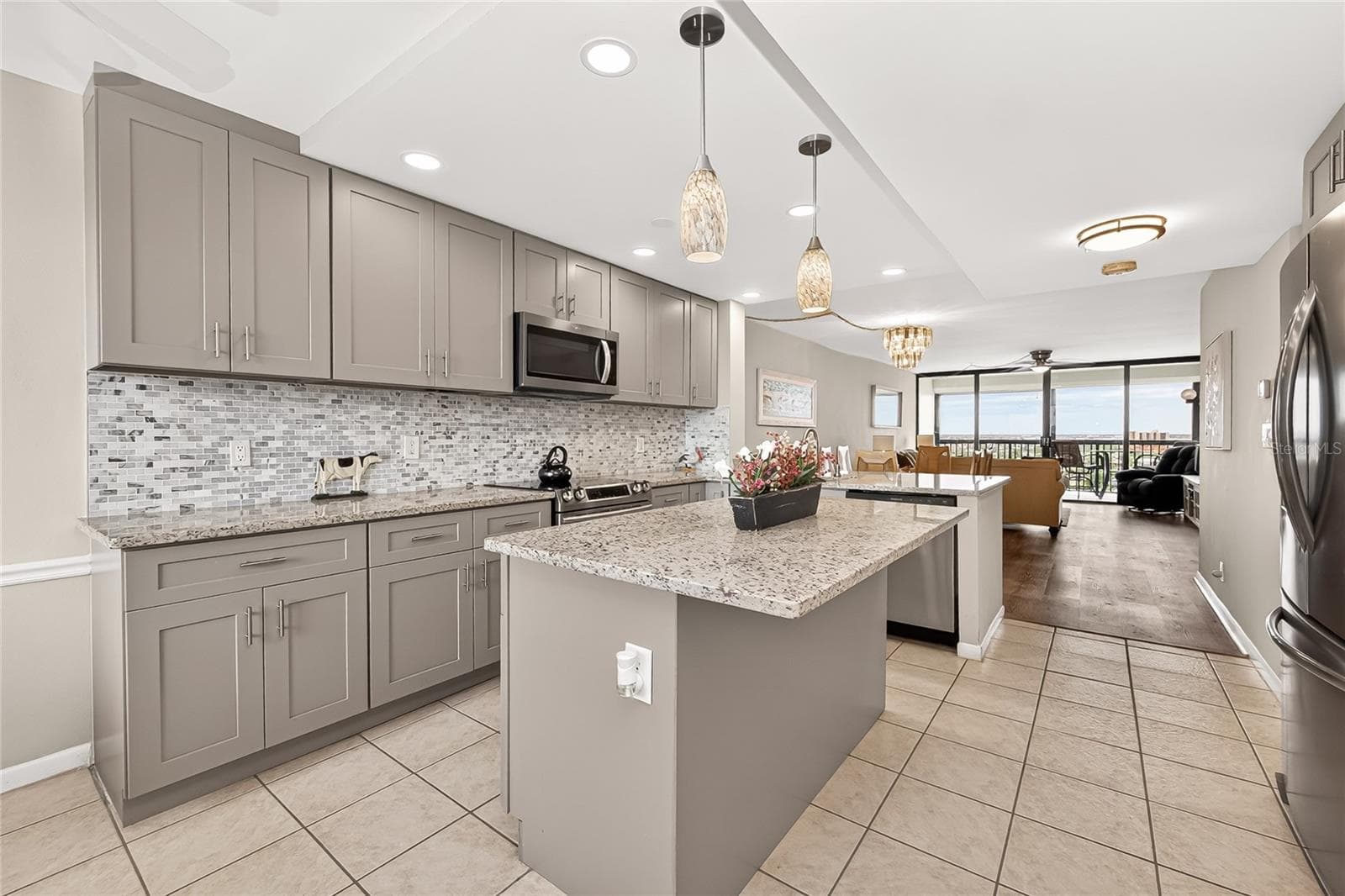 Updated kitchen with gorgeous water views in both the front and back - 9425 BLIND PASS RD #1103, ST PETE BEACH