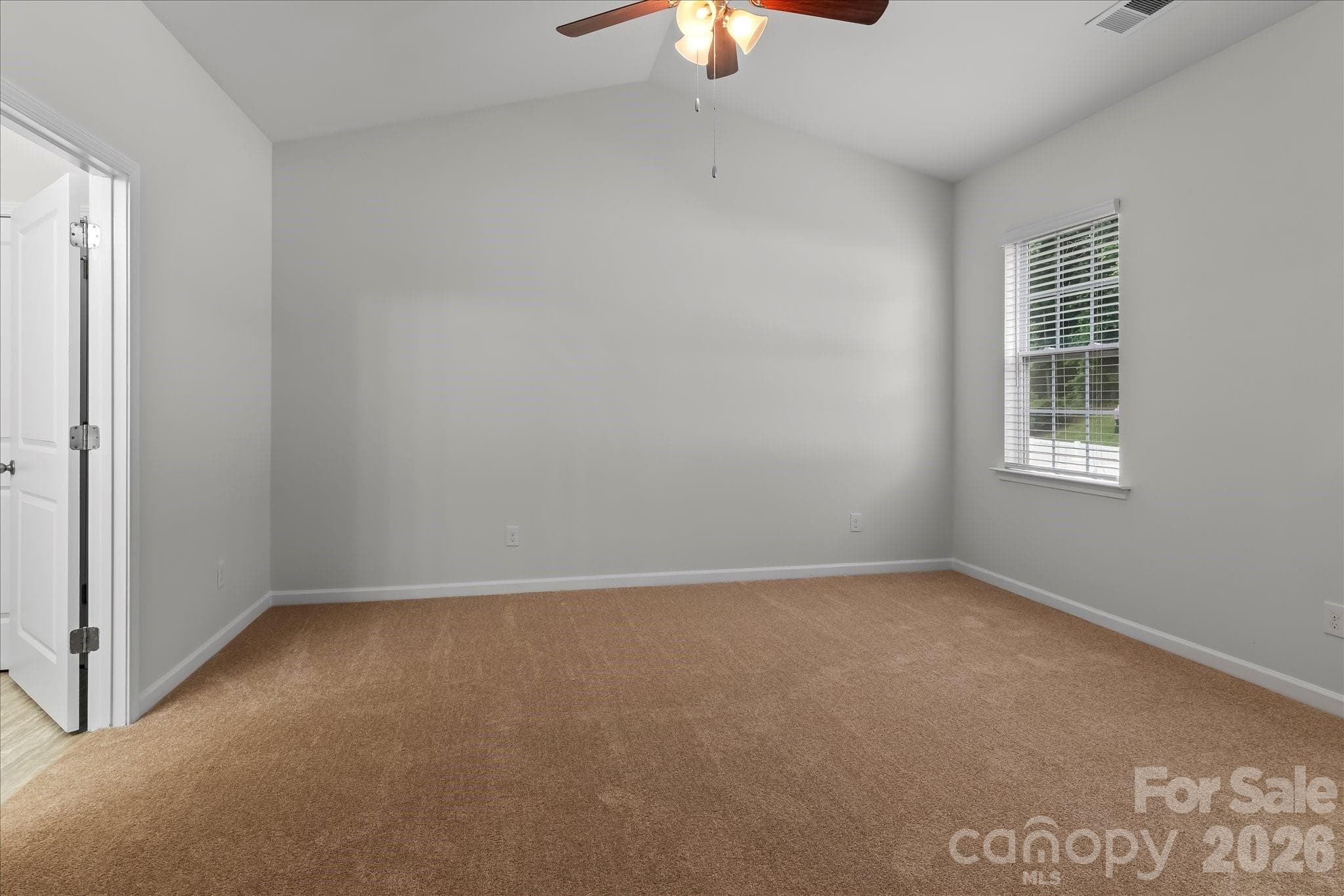 Primary bedroom with new carpet - Mooresville