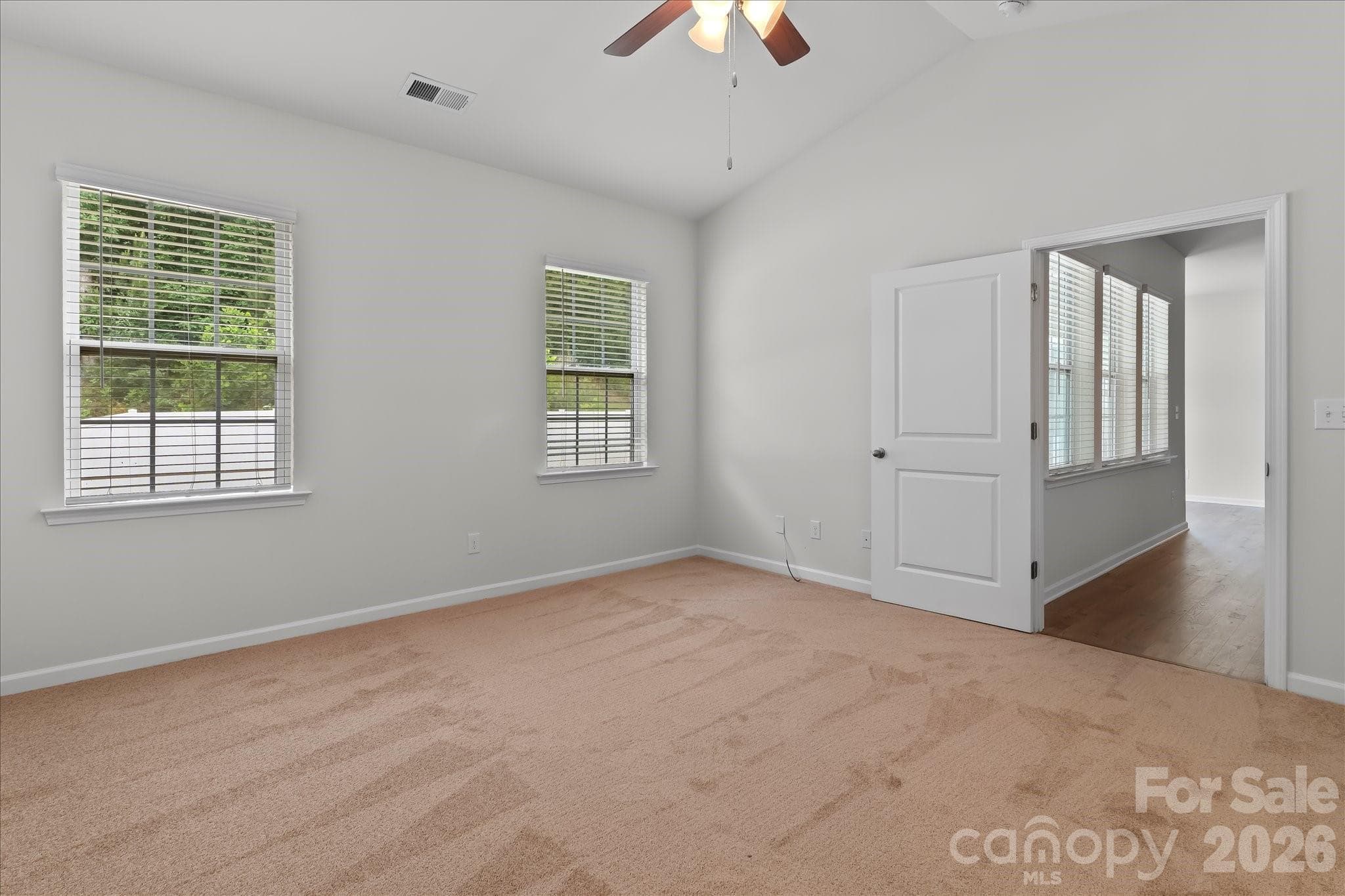Primary bedroom with new carpet - Mooresville