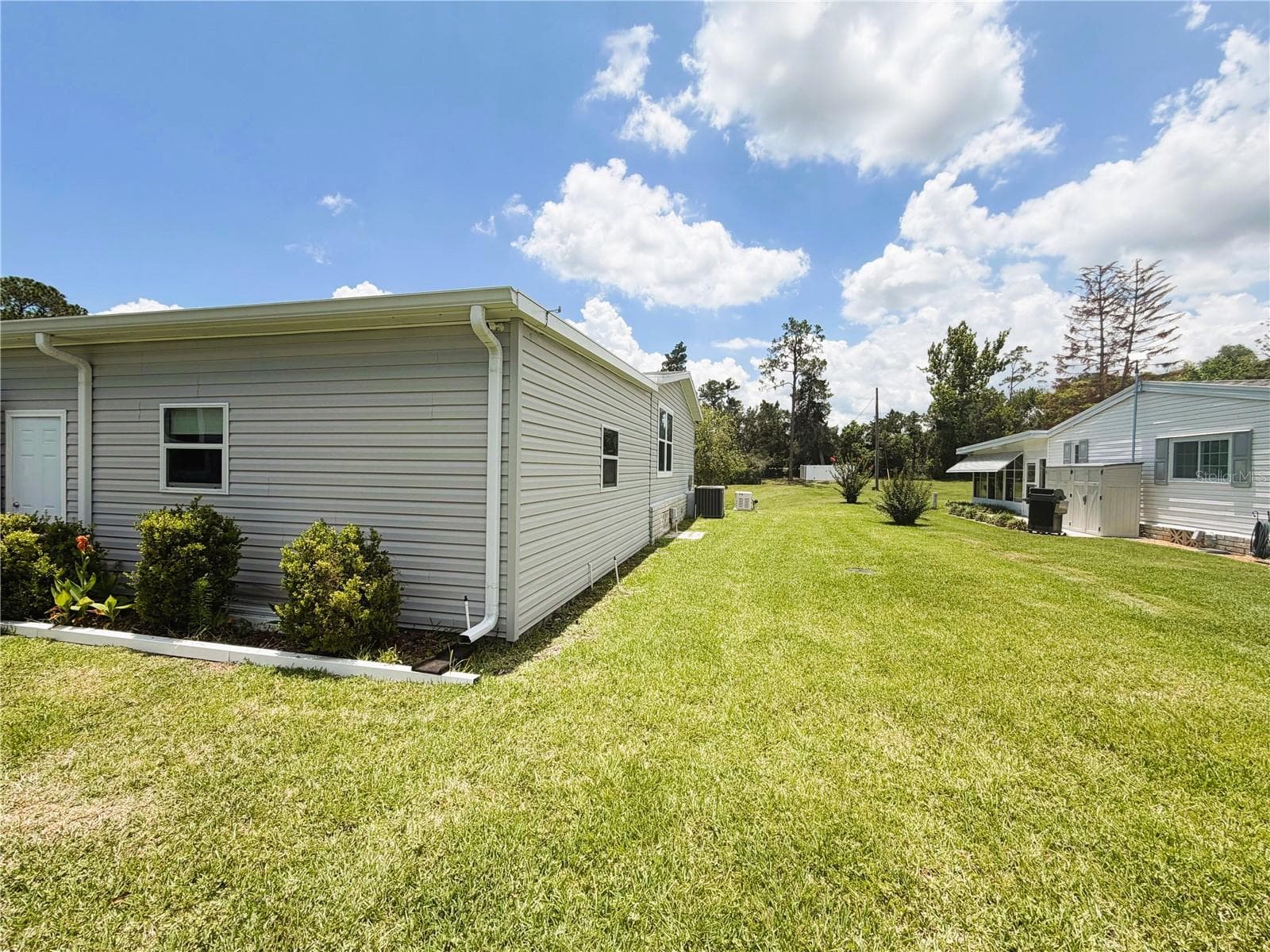 Manufactured Home at 165 SAGO PALM DR, LEESBURG, photo 18 of 63