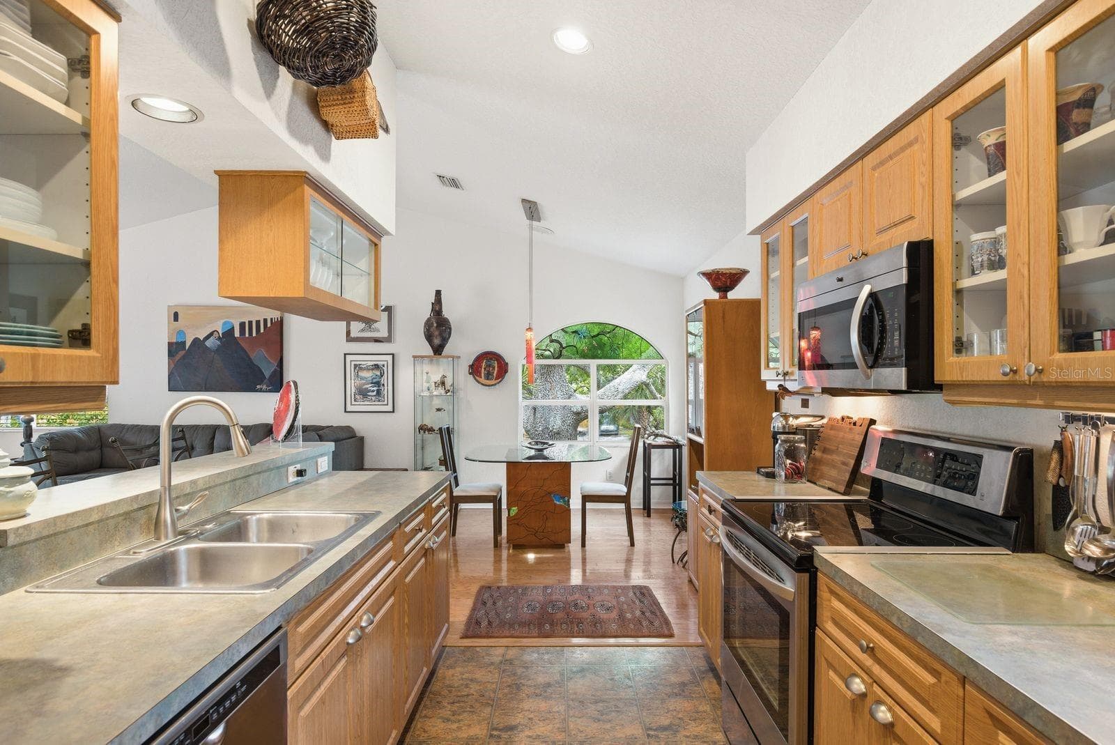 Kitchen to dining area. - 755 SAN CHRISTOPHER DR, DUNEDIN