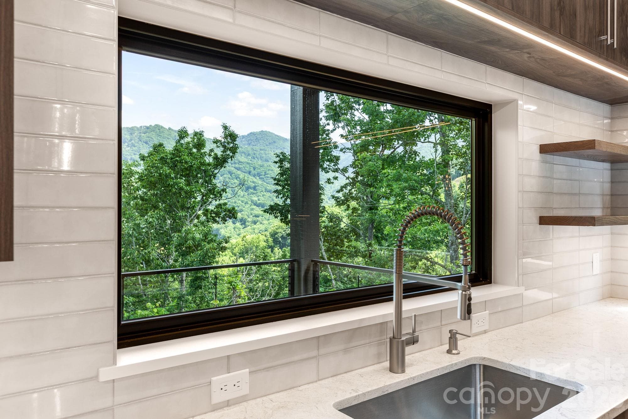 Kitchen sink window view. - 60 King Horn Ridge, Waynesville