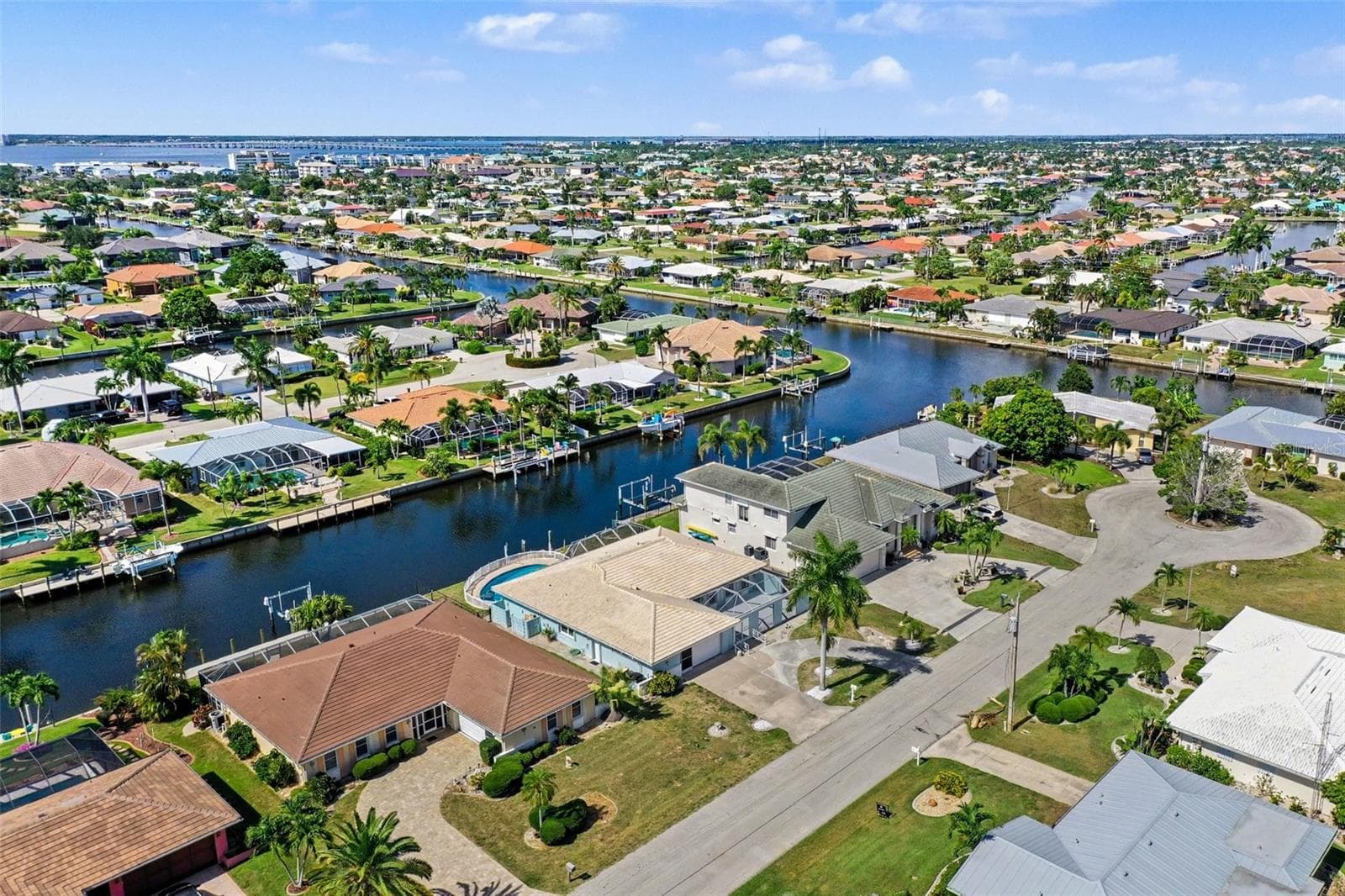 Aerial view facing northeast - heading to downtown Punta Gorda and upstream on the Peace River - you can take your boat to get there! - 548 BELVEDERE CT, PUNTA GORDA