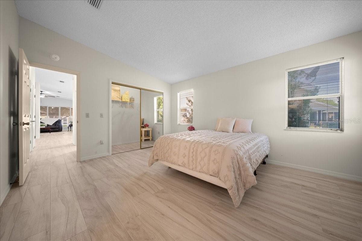 Primary Bedroom Features Vaulted Ceilings - 1133 DEL TORO DR, LADY LAKE