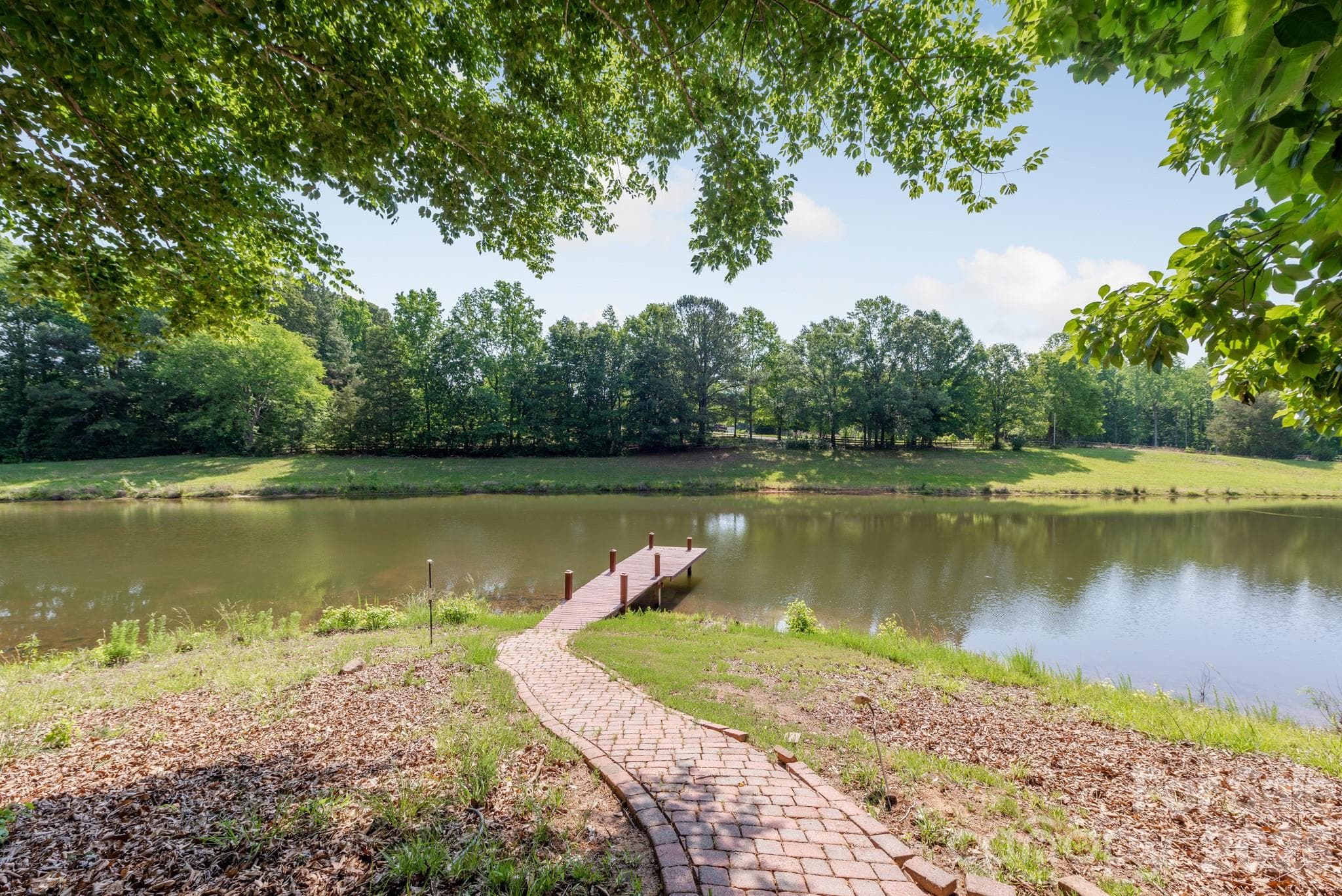 Enjoy sunset views on your own dock. - 4709 Rockwood Drive, Waxhaw