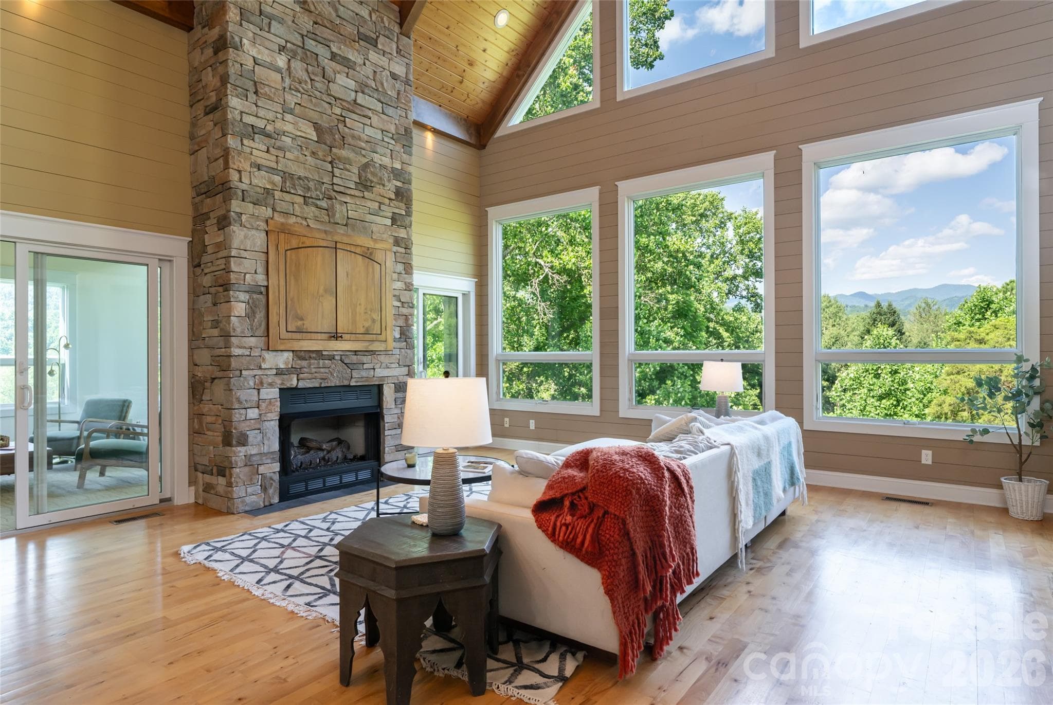 Architecturally designed to maximize natural light and mountain views, featuring soaring ceilings, dramatic windows, and skylights. - 33 Bridle Path Drive, Barnardsville