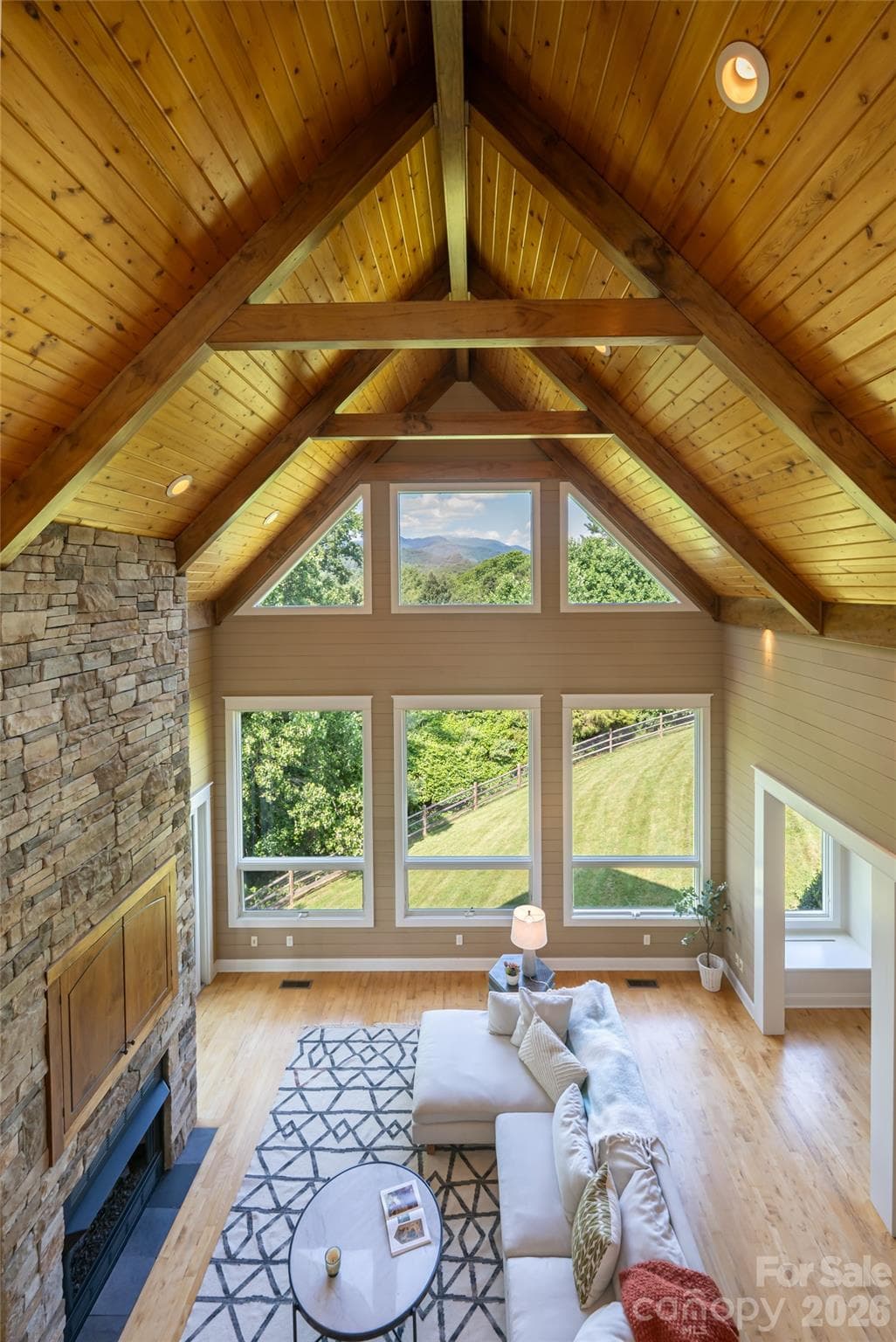 Upper level loft area featuring a breezeway that overlooks the great room. - 33 Bridle Path Drive, Barnardsville