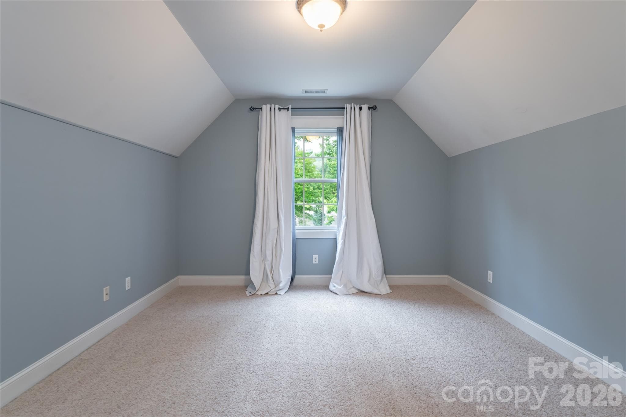 Versatile upper-level guest suite, highlighting its privacy and comfort within the home's layout. - 33 Bridle Path Drive, Barnardsville