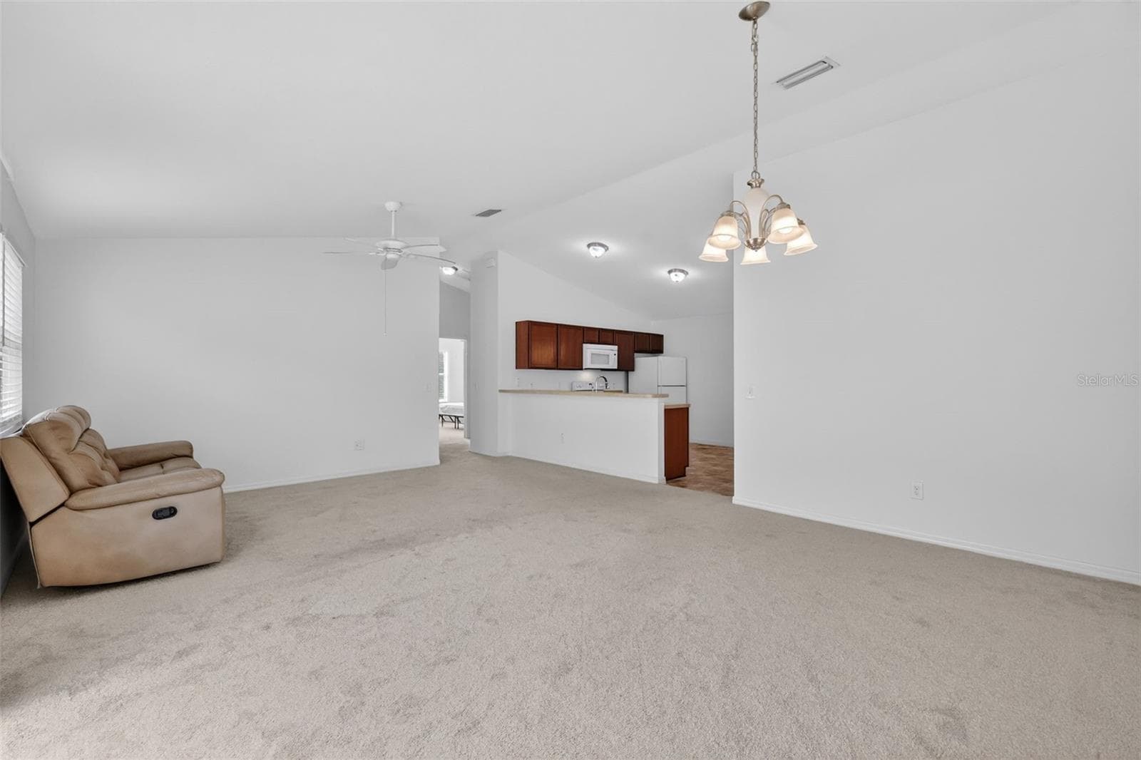 Living, Dining, and Kitchen - 3419 CARRABELLE CT, THE VILLAGES