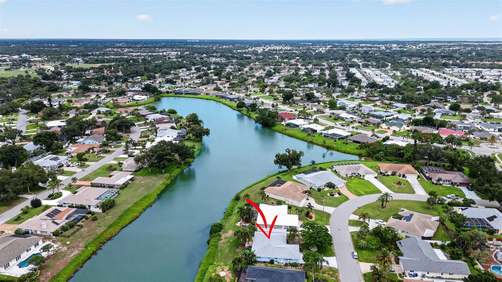 1226 Pine Needle located on a lake in Pinebrook South - 1226 PINE NEEDLE RD, VENICE