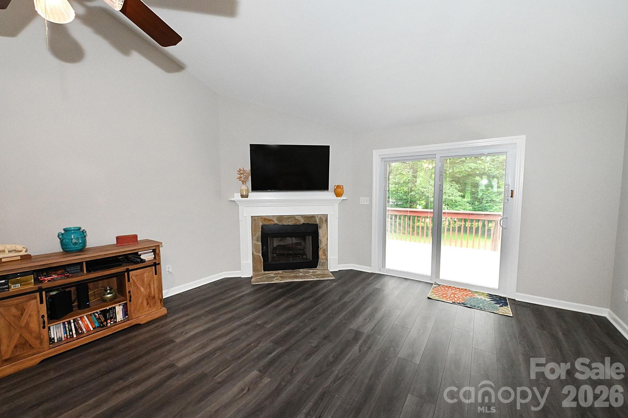 Living room with easily maintained vinyl plank flooring - Newton