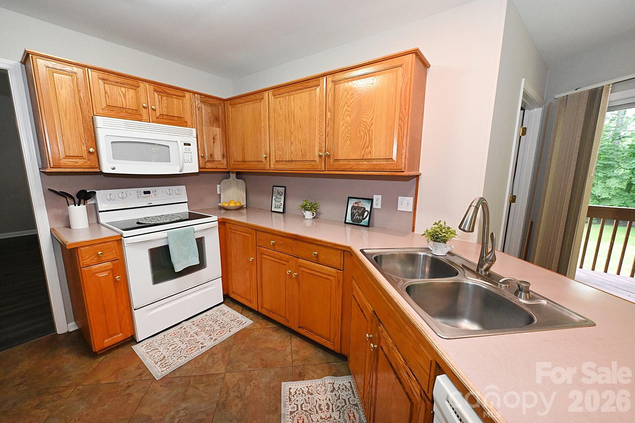 Behind this kitchen is a bonus room that be be used as an office, hobby room, game room etc. - Newton