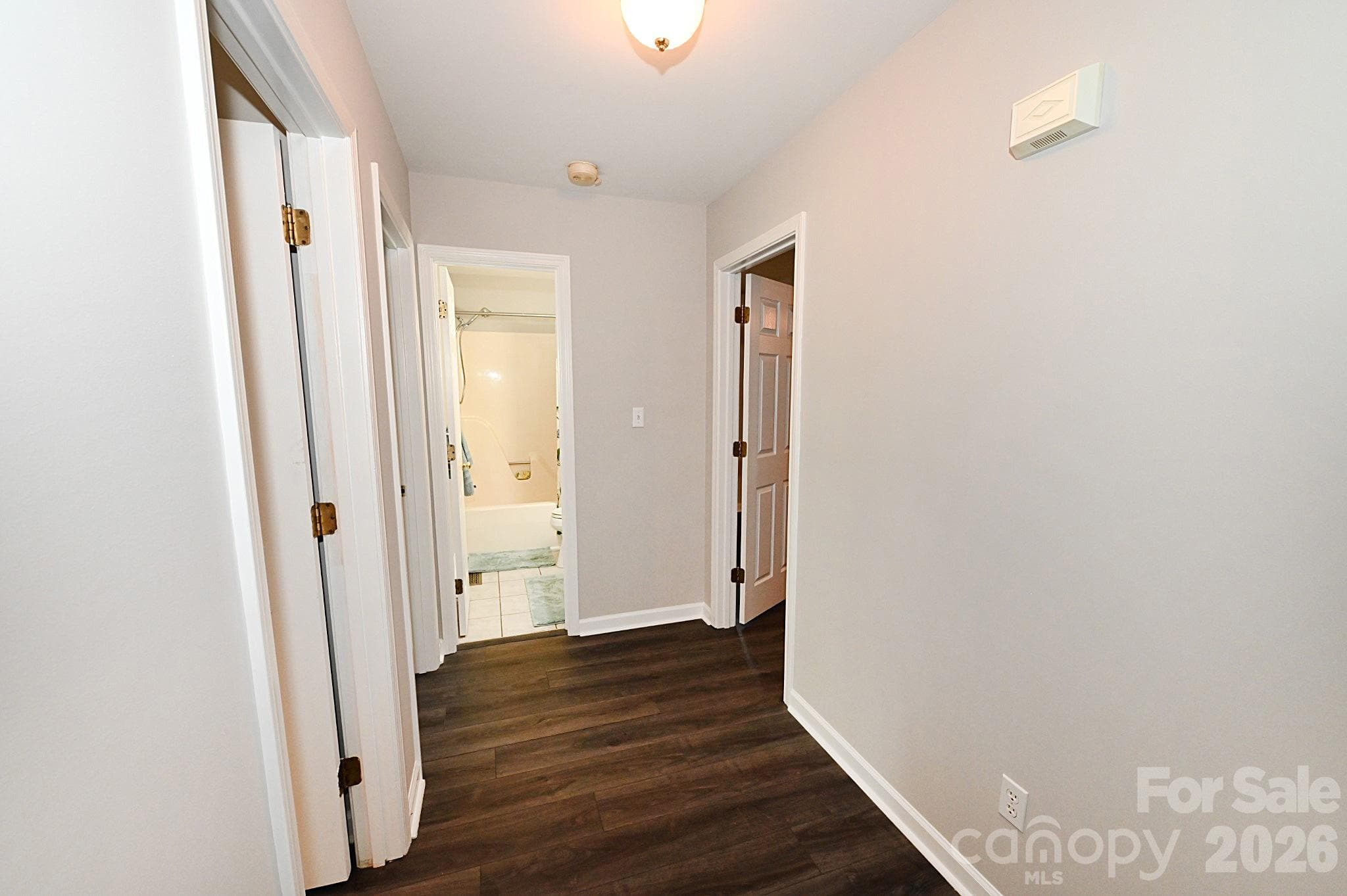 To the left of the entrance way is the hallway to 3 bedrooms and 2 bathrooms - Newton