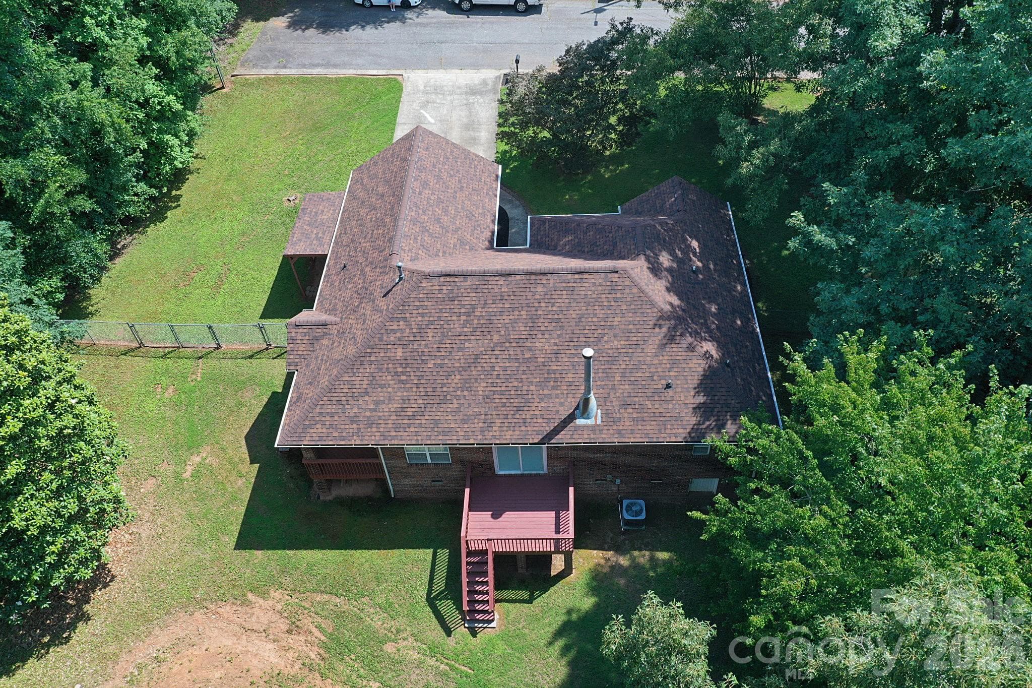 Aerial view of the home with fenced in backyard. Home located at the end of the street - Newton