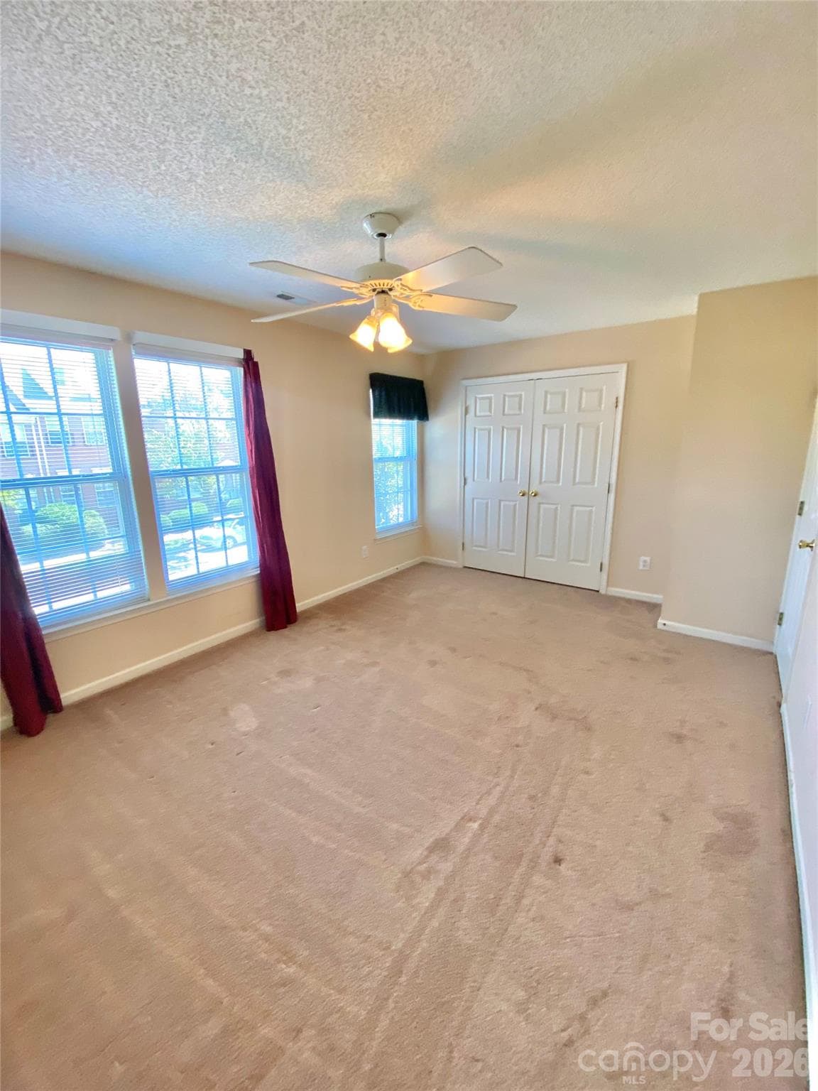 Secondary Bedroom overlooking front, street view of townhome. - 6025 Creft Circle, Indian Trail